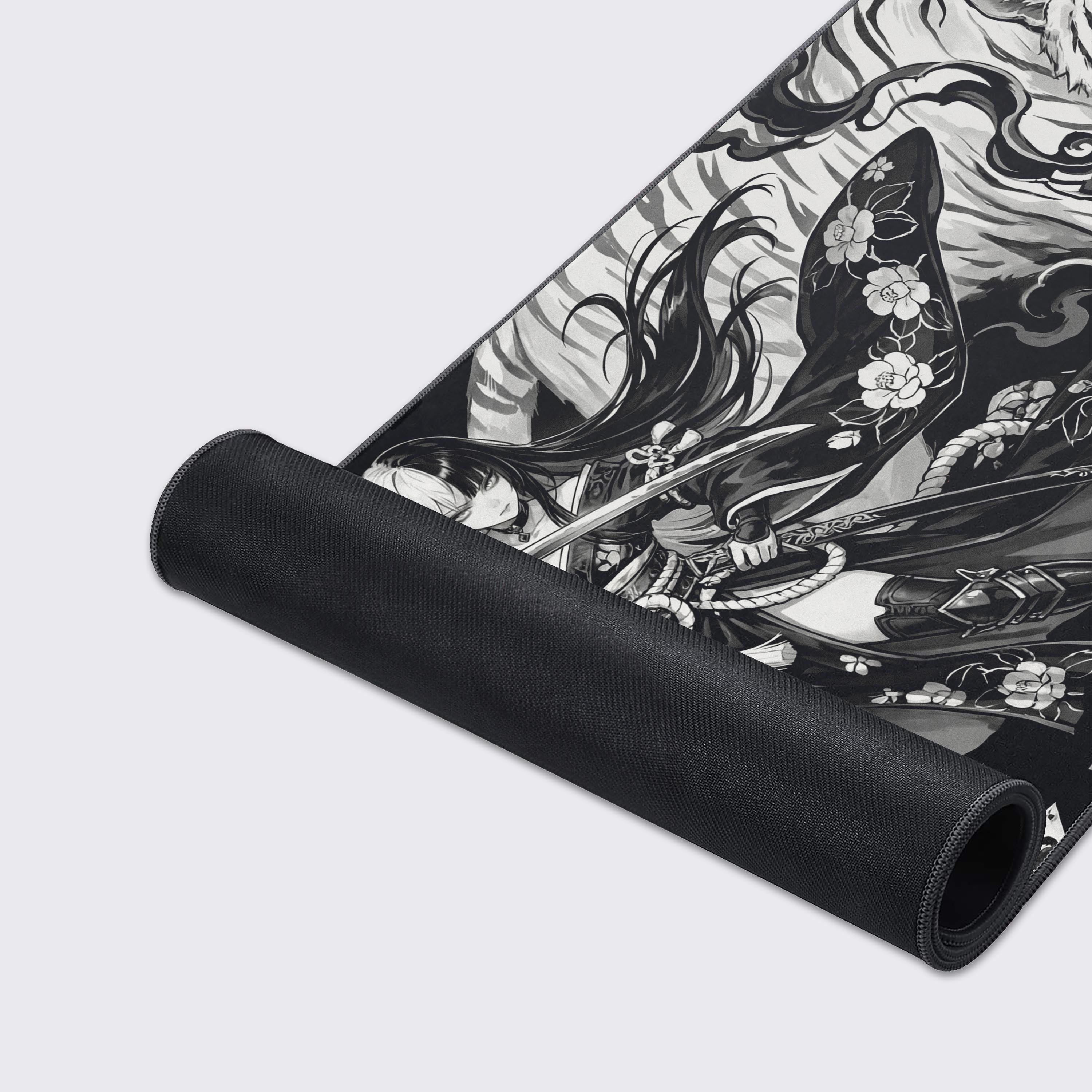 A close-up of the Spirit Blade gaming desk mat, highlighting the durable stitched edges and smooth fabric texture of the monochromatic warrior and tiger artwork. - Epic Design Pads & Mousepads