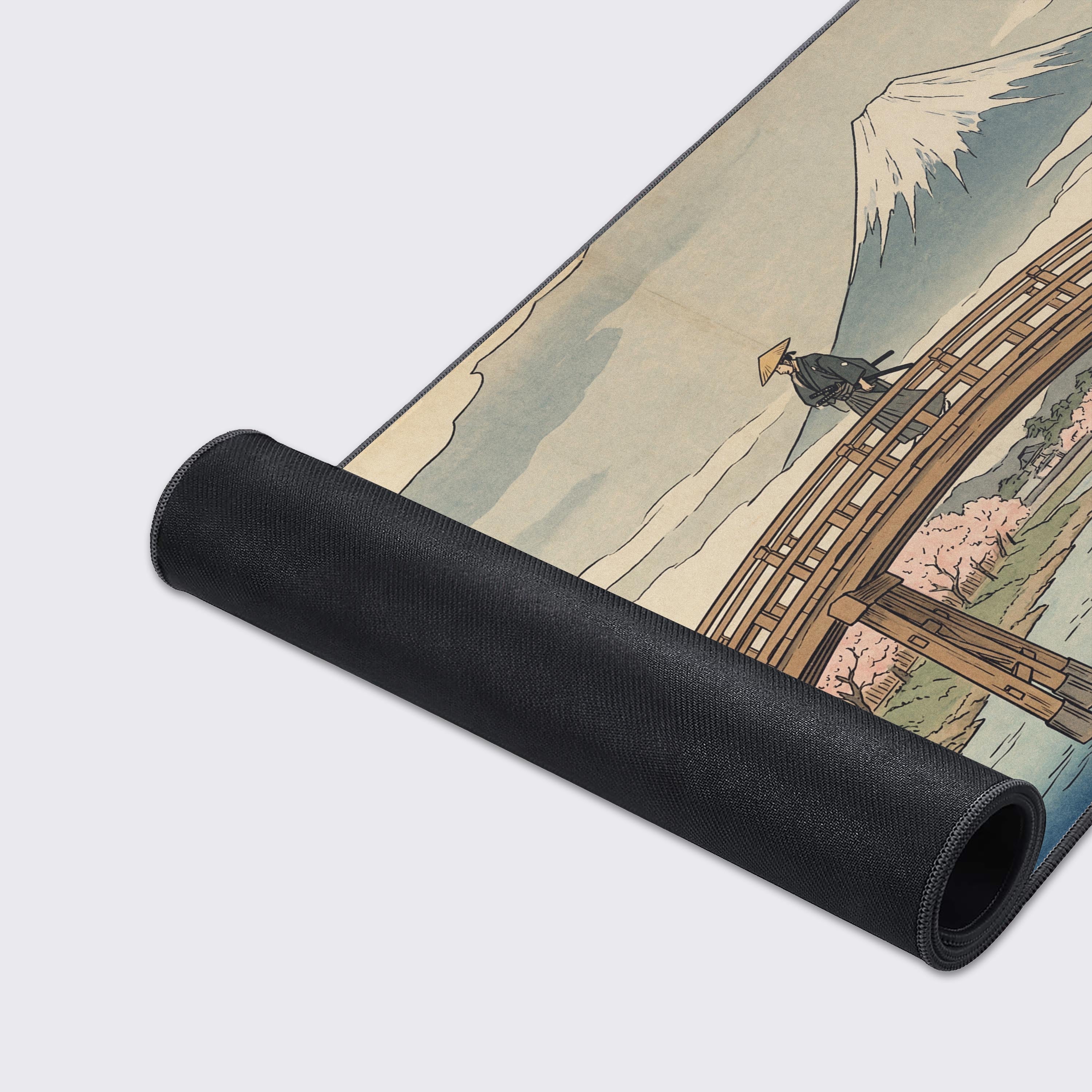 Close-up of the smooth fabric and stitched edges on 'The Ronin’s Crossing' gaming desk mat, showcasing the detailed samurai on a bridge artwork and durable construction. - Epic Design Pads & Mousepads