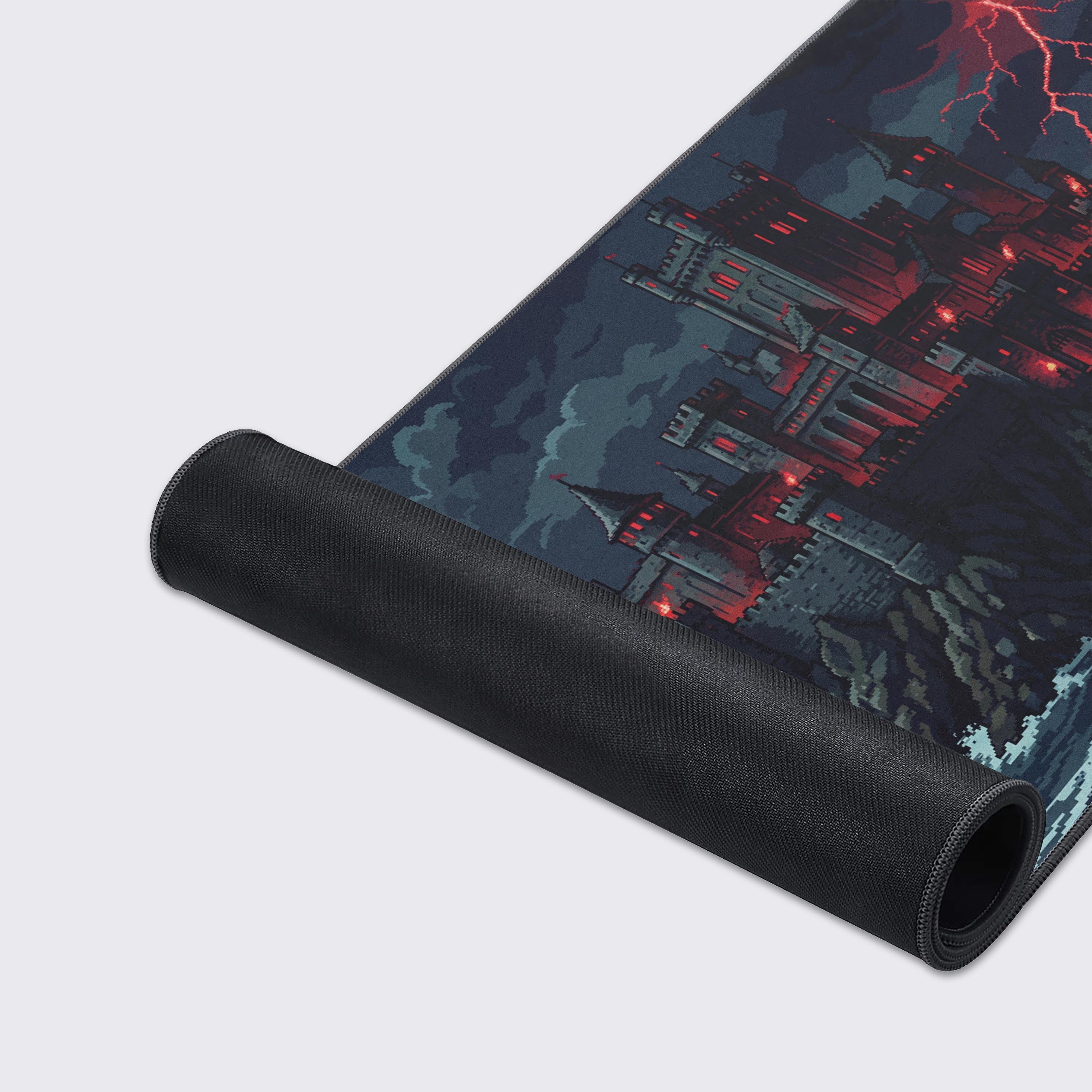 A close-up of the Pixel Citadel gaming desk mat showing the high-quality fabric texture and durable stitched edges, with the detailed pixel art castle and red lightning. - Epic Design Pads & Mousepads