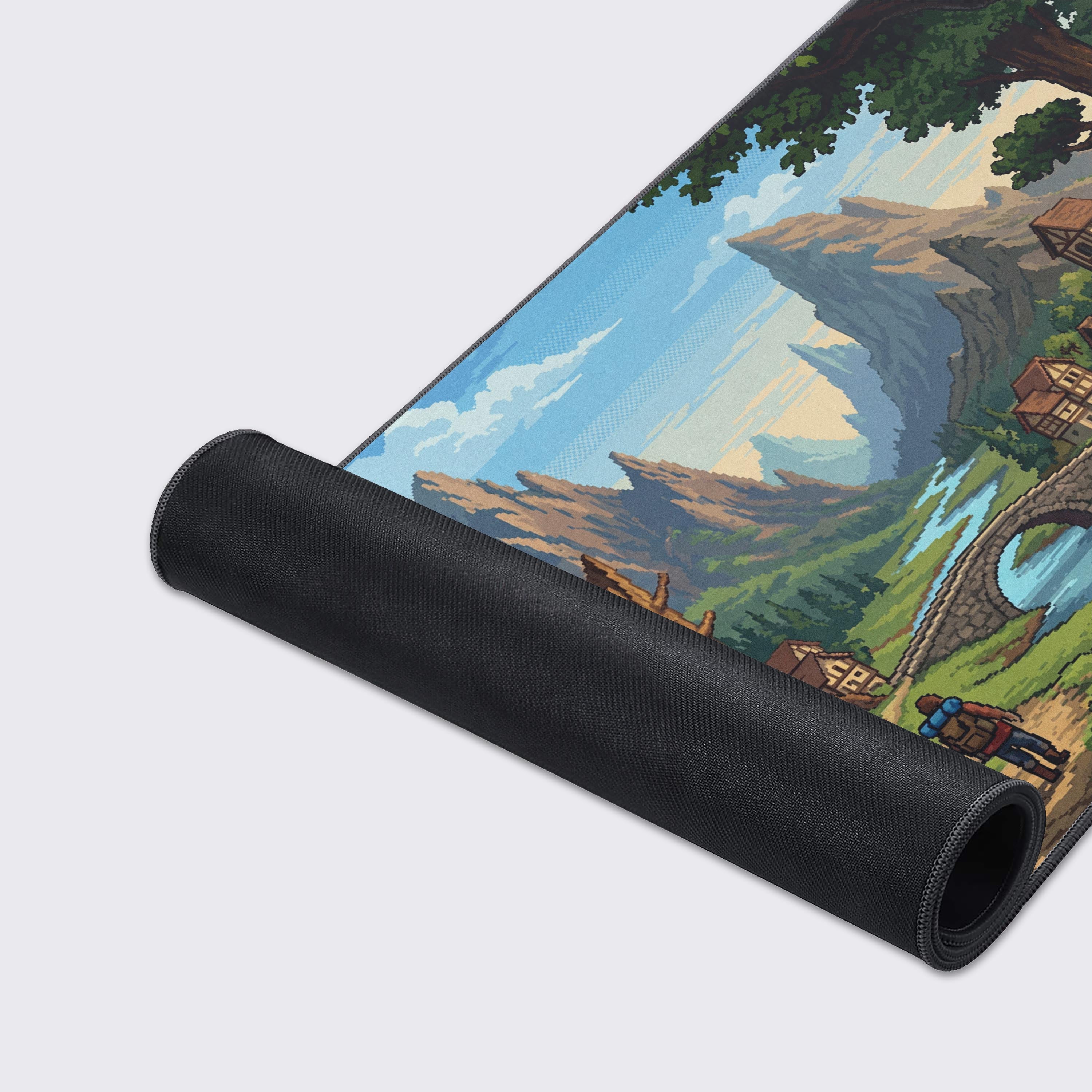Close-up of the Valley Hamlet gaming desk mat, highlighting the high-quality fabric texture and durable stitched edges. The detailed pixel art of the fantasy village is clearly visible. - Epic Design Pads & Mousepads
