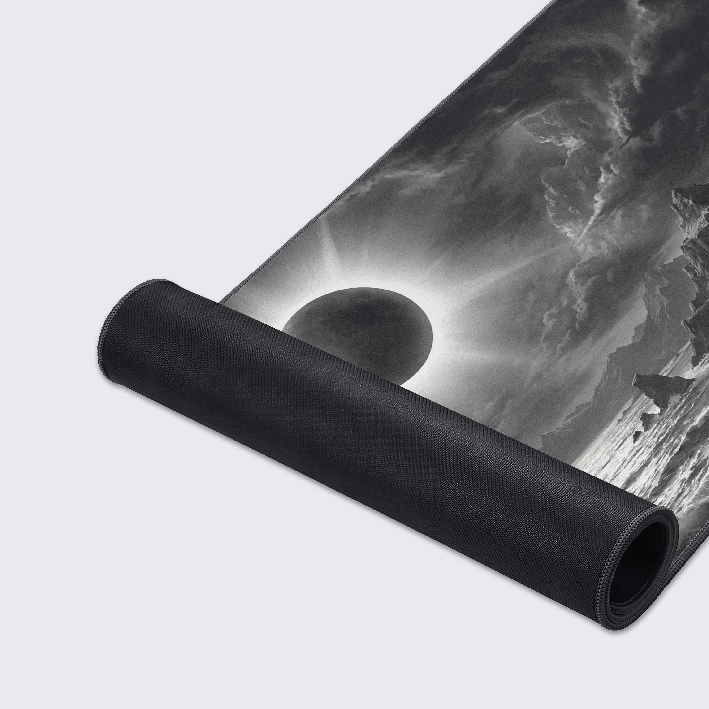 A close-up of the Eclipse Storm gaming desk mat's smooth texture and durable stitched edges, highlighting the detailed monochrome artwork of the turbulent ocean. - Epic Design Pads & Mousepads