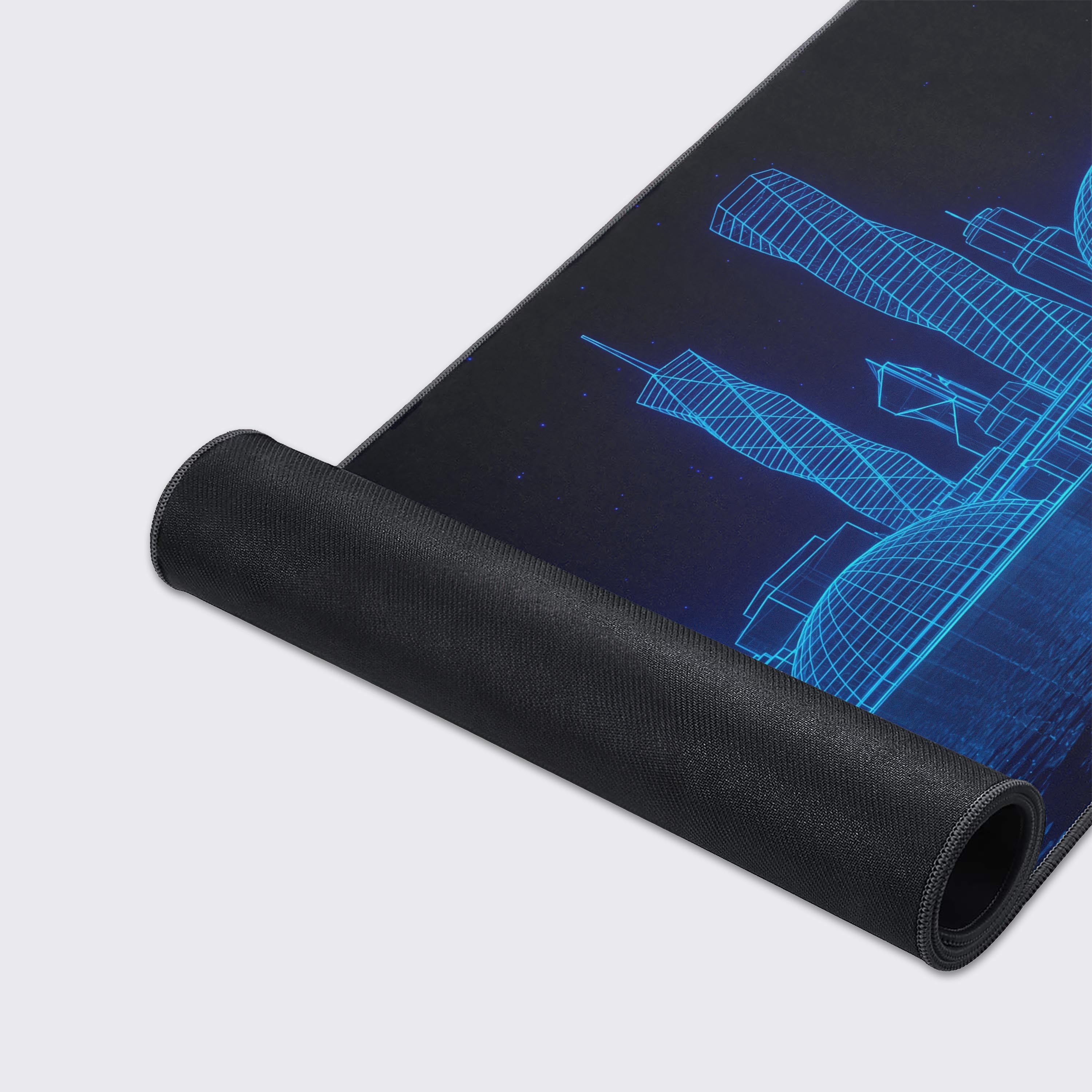 Close-up of the Digital Skyline gaming desk mat, highlighting the smooth texture, stitched edges, and detailed blue wireframe cityscape design. - Epic Design Pads & Mousepads