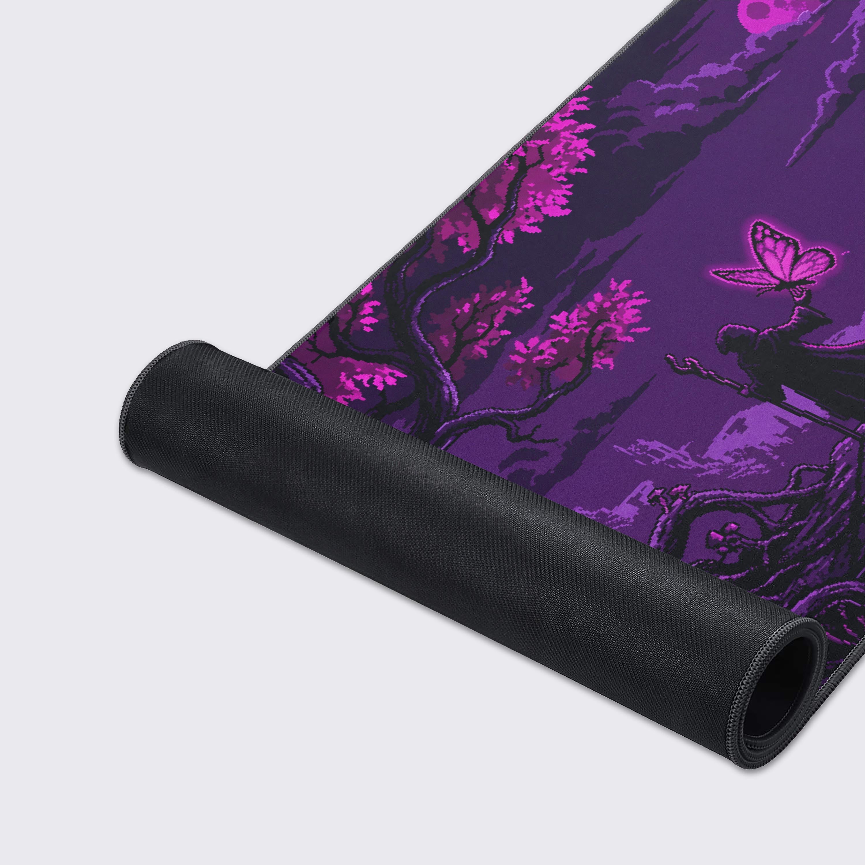 A close-up of the Violet Realm gaming desk mat, highlighting the detailed pixel art design and durable stitched edges on the smooth, purple fabric surface. - Epic Design Pads & Mousepads