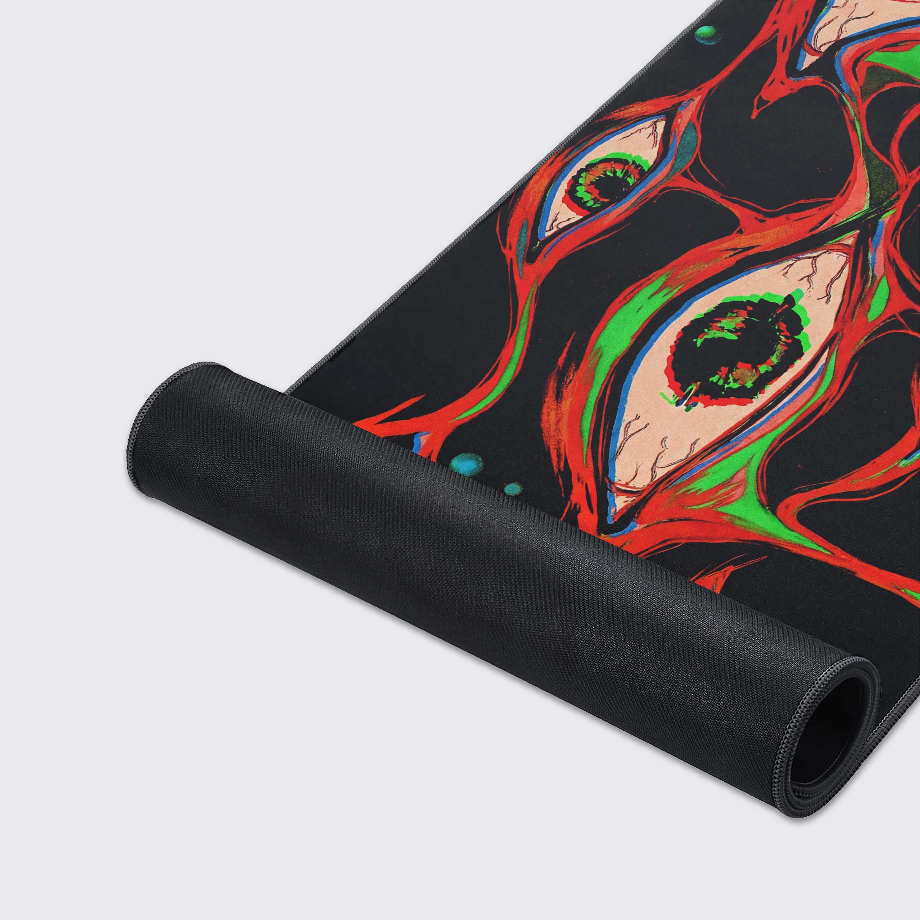 Close-up of the Glitch Gaze Gaming Desk Mat's high-quality textured surface and durable stitched edges, highlighting the vibrant red and green abstract design. - Epic Design Pads & Mousepads