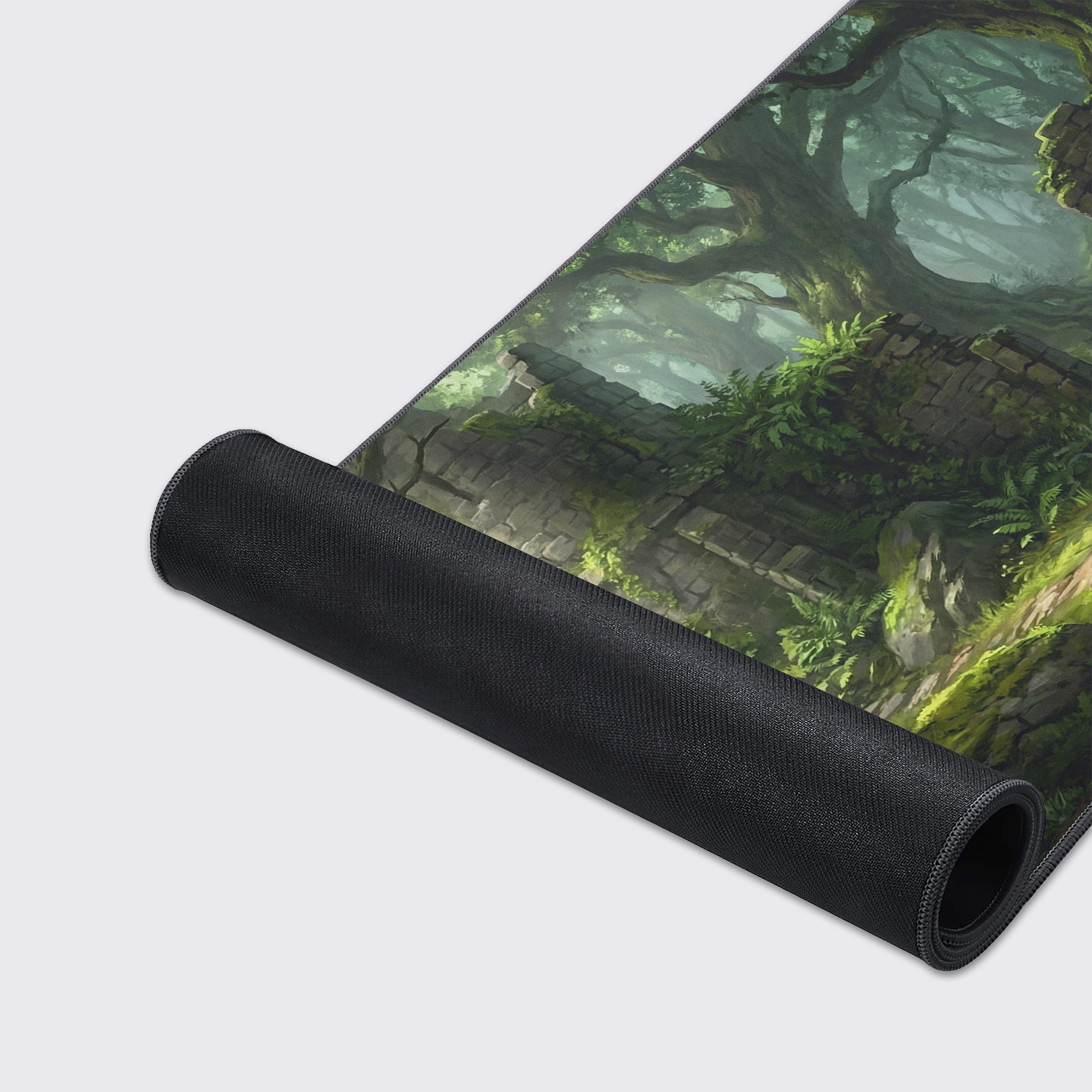 Close-up of the Forgotten Path Gaming Desk Mat, highlighting the high-quality fabric texture and durable stitched edges of the lush, mossy forest ruins artwork. - Epic Design Pads & Mousepads