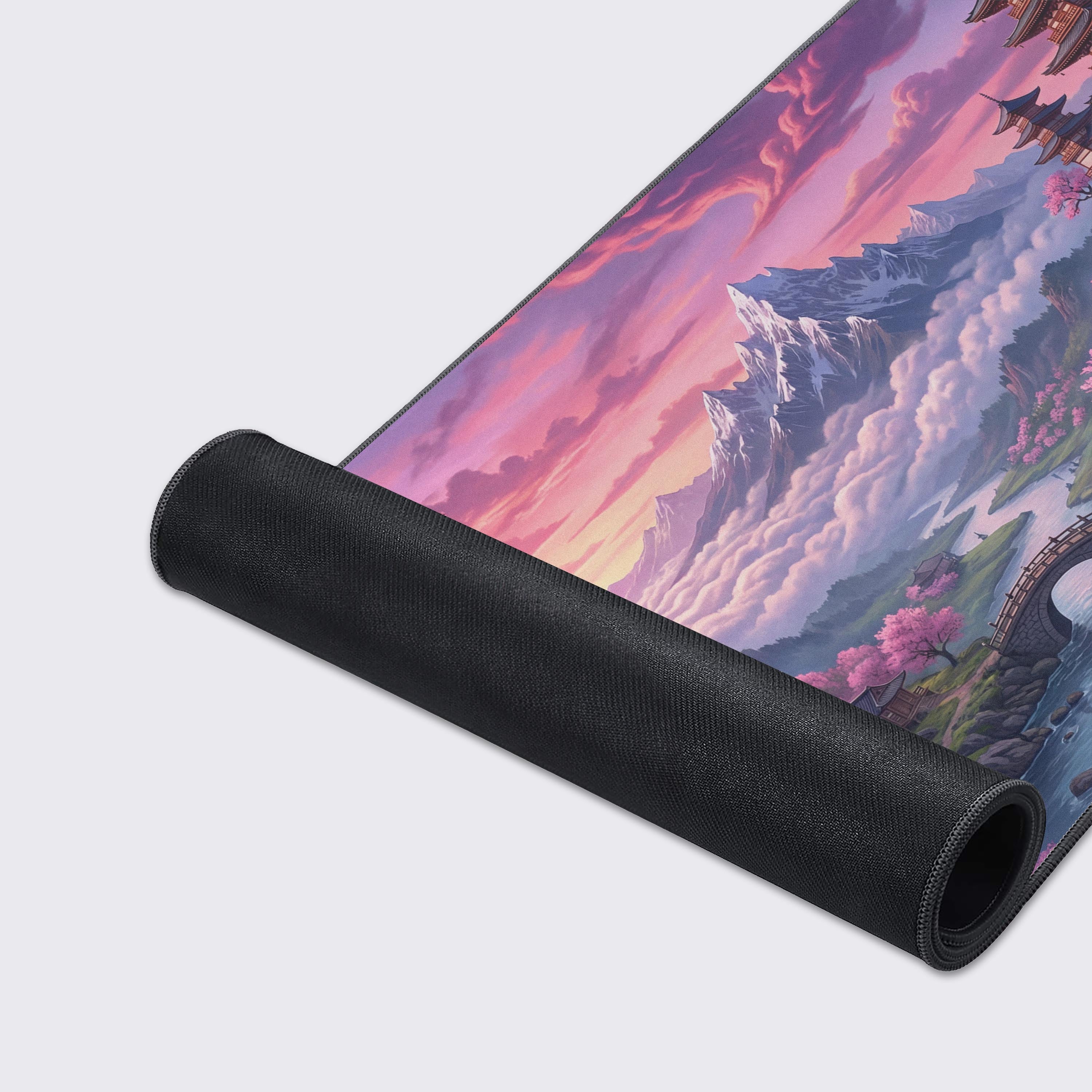 A close-up of the Sakura Summit gaming desk mat, highlighting the smooth fabric texture and durable stitched edges against the detailed Japanese pagoda and cherry blossom art. - Epic Design Pads & Mousepads