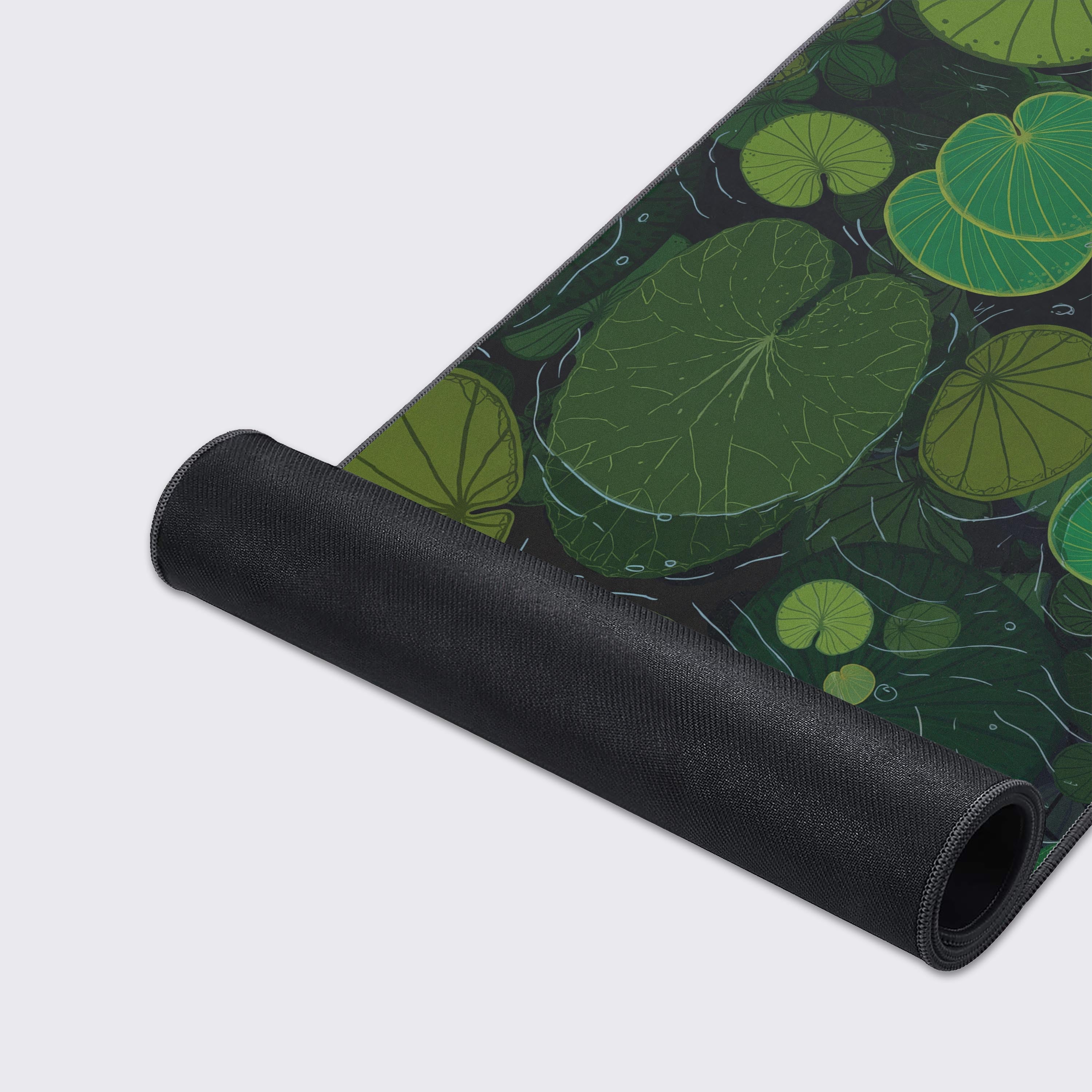 Close-up of the Lily Pads mouse pad showcasing the smooth fabric texture and durable stitched edges, with the vibrant green lily pad artwork providing a calming visual. - Epic Design Pads & Mousepads
