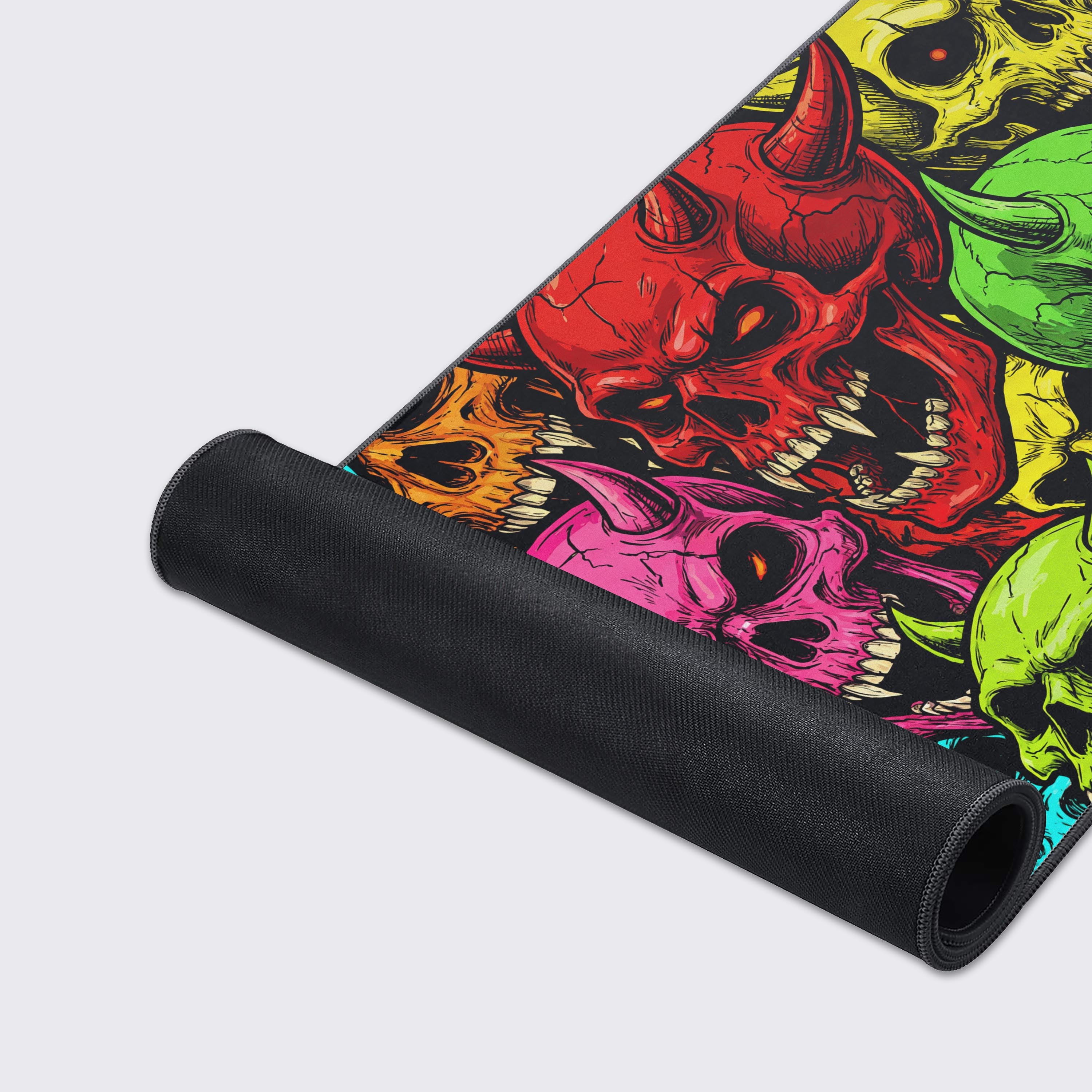 A close-up of the Vibrant Souls mouse pad's smooth surface and durable stitched edges, highlighting the detailed, colorful horned skull artwork. - Epic Design Pads & Mousepads