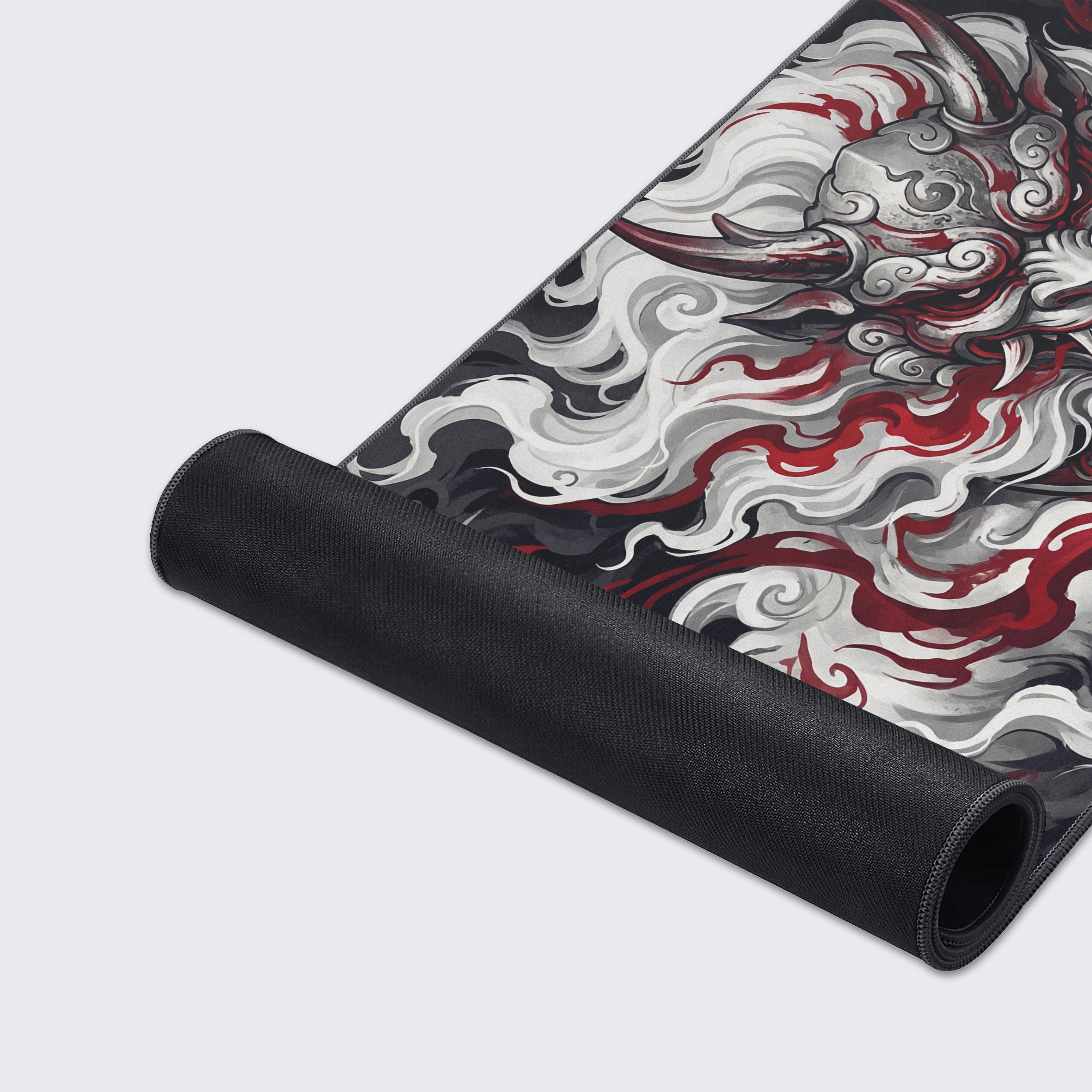 A close-up of the Smoke Sentinel gaming desk mat, showcasing its smooth fabric texture, stitched edges, and detailed Japanese mythology artwork. - Epic Design Pads & Mousepads