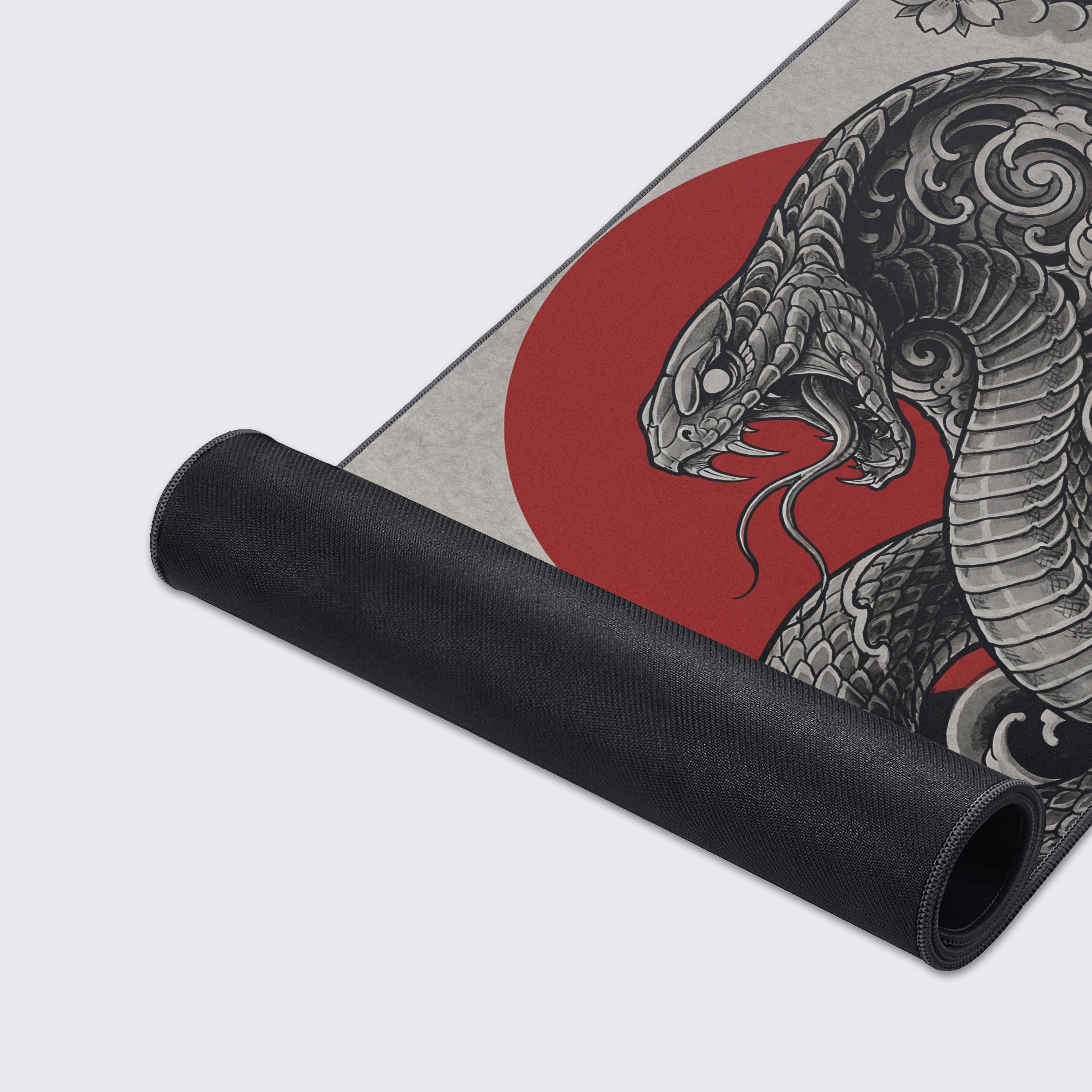 A close-up of the Crimson Viper mouse pad's high-quality fabric texture and durable stitched edges, highlighting the intricate details of the cobra design. - Epic Design Pads & Mousepads