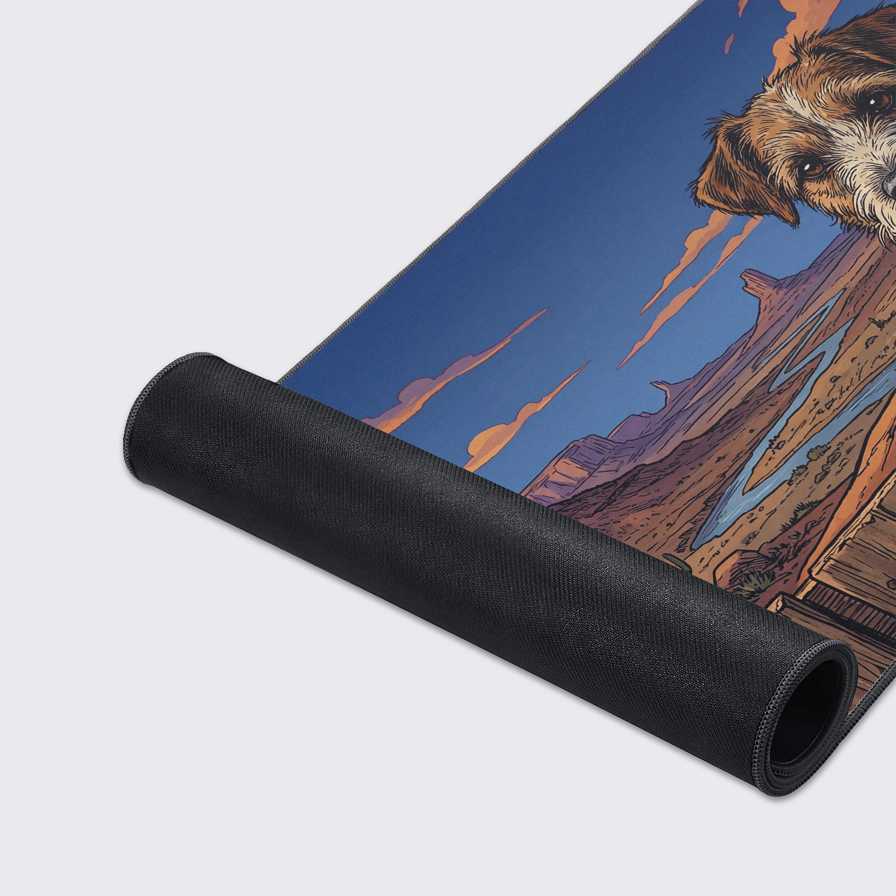 A close-up of the Canyon Terrier gaming desk mat, highlighting the durable stitched edges and smooth fabric texture of the vibrant dog and desert landscape design. - Epic Design Pads & Mousepads