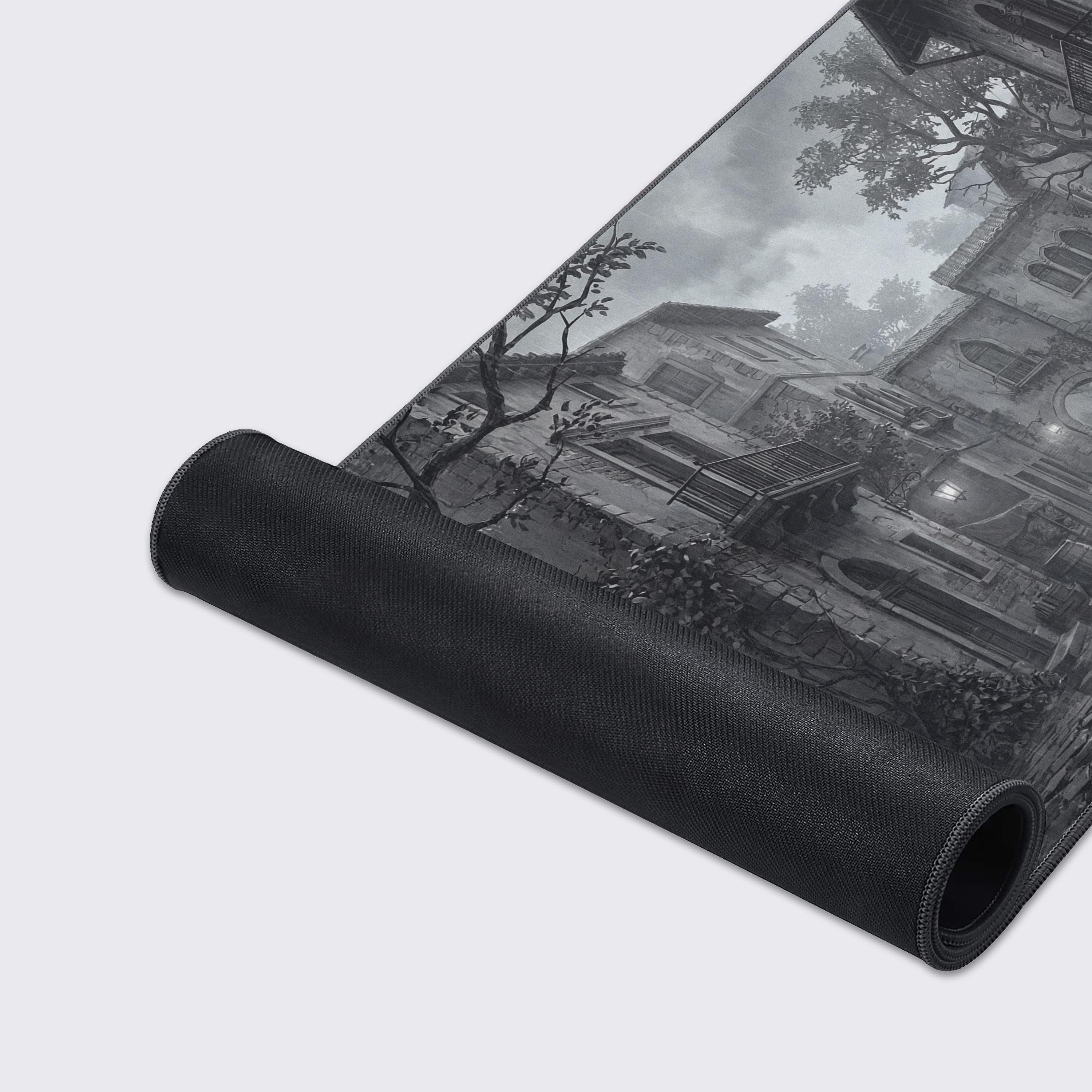 Close-up of the Silent Rain gaming desk mat's high-quality fabric and stitched edges, detailing the moody, rain-slicked cobblestone street design. - Epic Design Pads & Mousepads