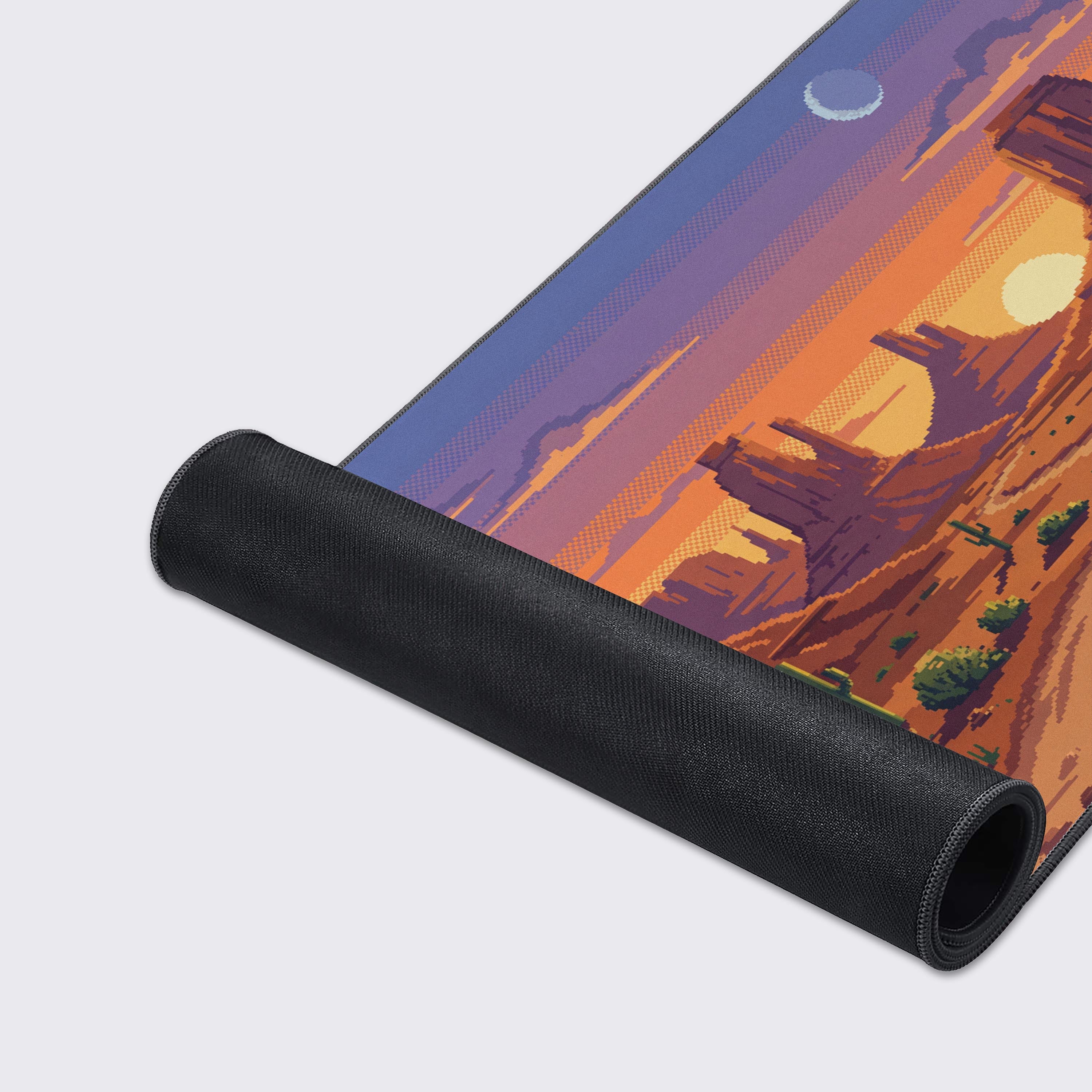 A close-up of the 8-Bit Dusk Gaming Desk Mat, highlighting the detailed pixel art texture and durable anti-fray stitched edges for a premium feel and performance. - Epic Design Pads & Mousepads