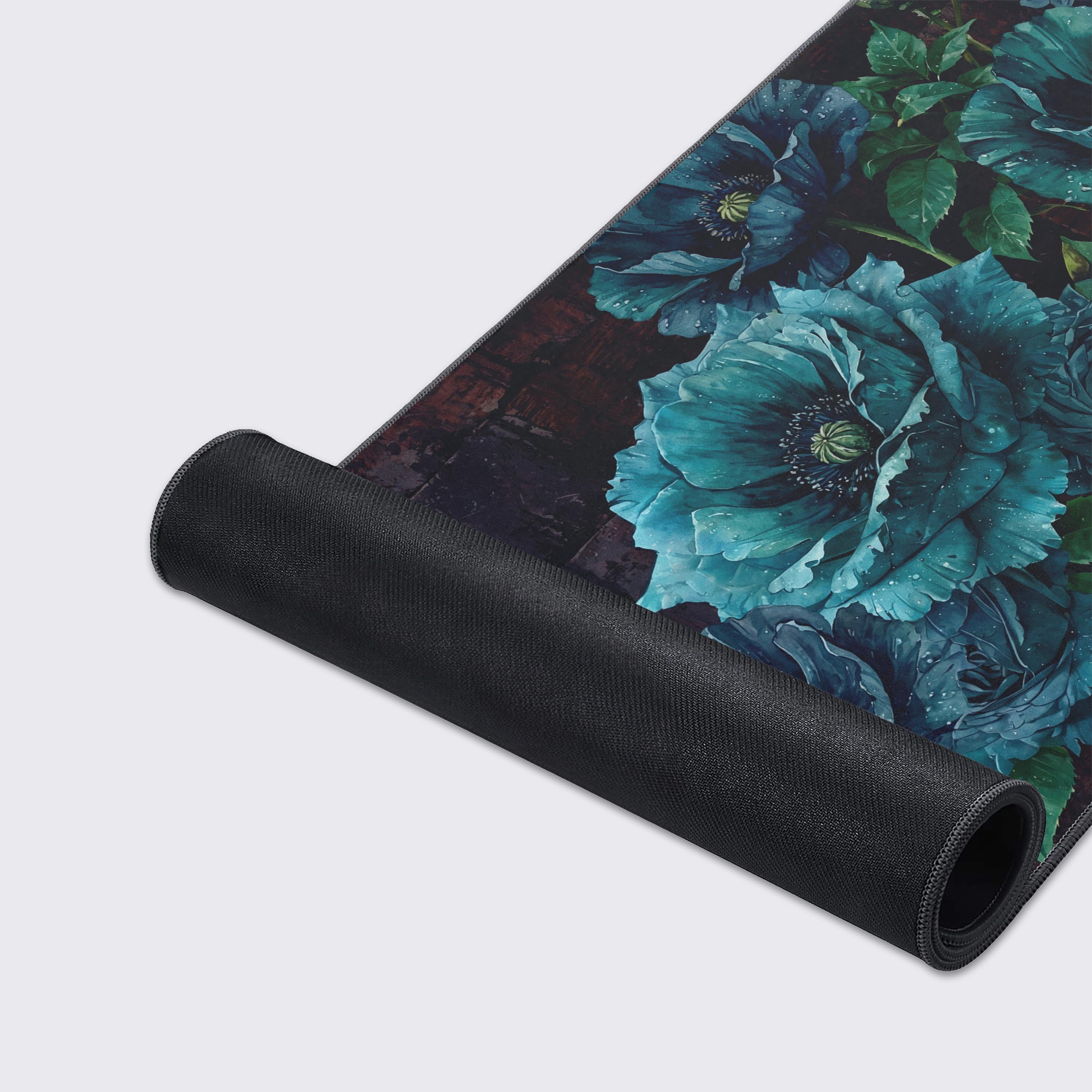 A close-up of the Velvet Bloom gaming desk mat highlighting the durable stitched edges and the ultra-smooth texture of the moody blue poppy design. - Epic Design Pads & Mousepads