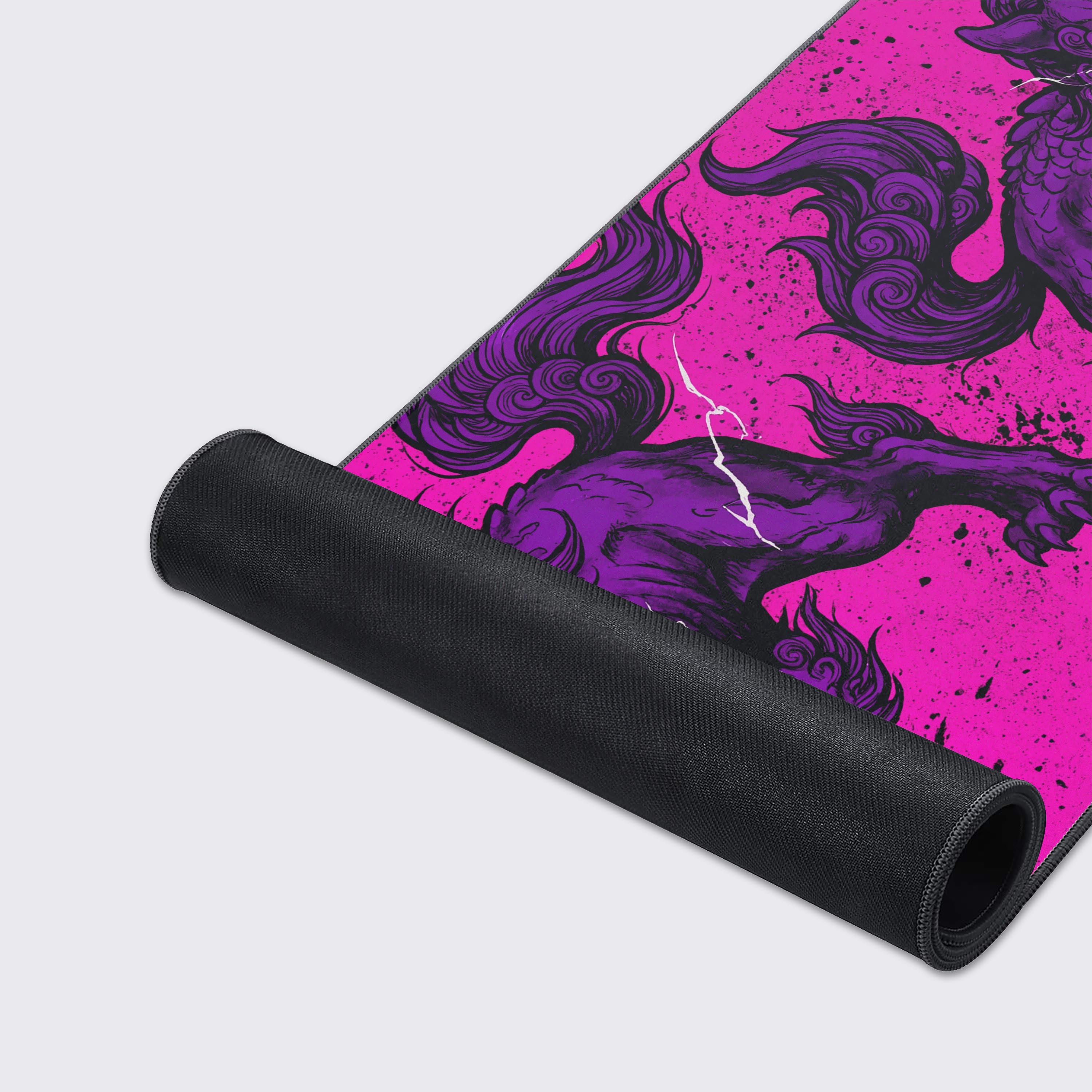 A close-up of the Voltage Beast gaming desk mat highlighting the smooth texture, stitched edges, and detailed purple guardian lion artwork. - Epic Design Pads & Mousepads