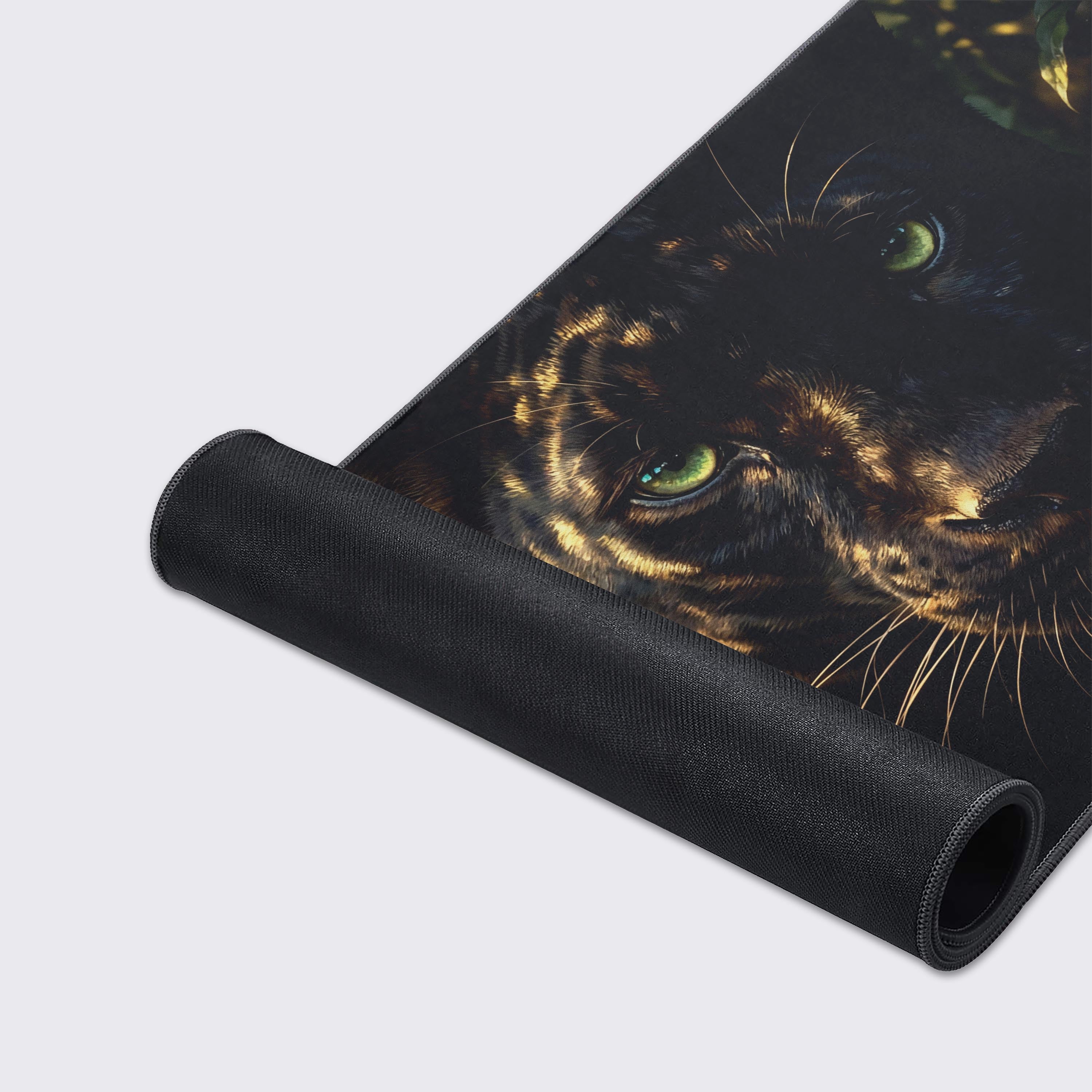 A close-up of the high-quality stitched edges and detailed fabric texture of the black panther gaming desk mat, showcasing its premium build and intense, lifelike artwork. - Epic Design Pads & Mousepads