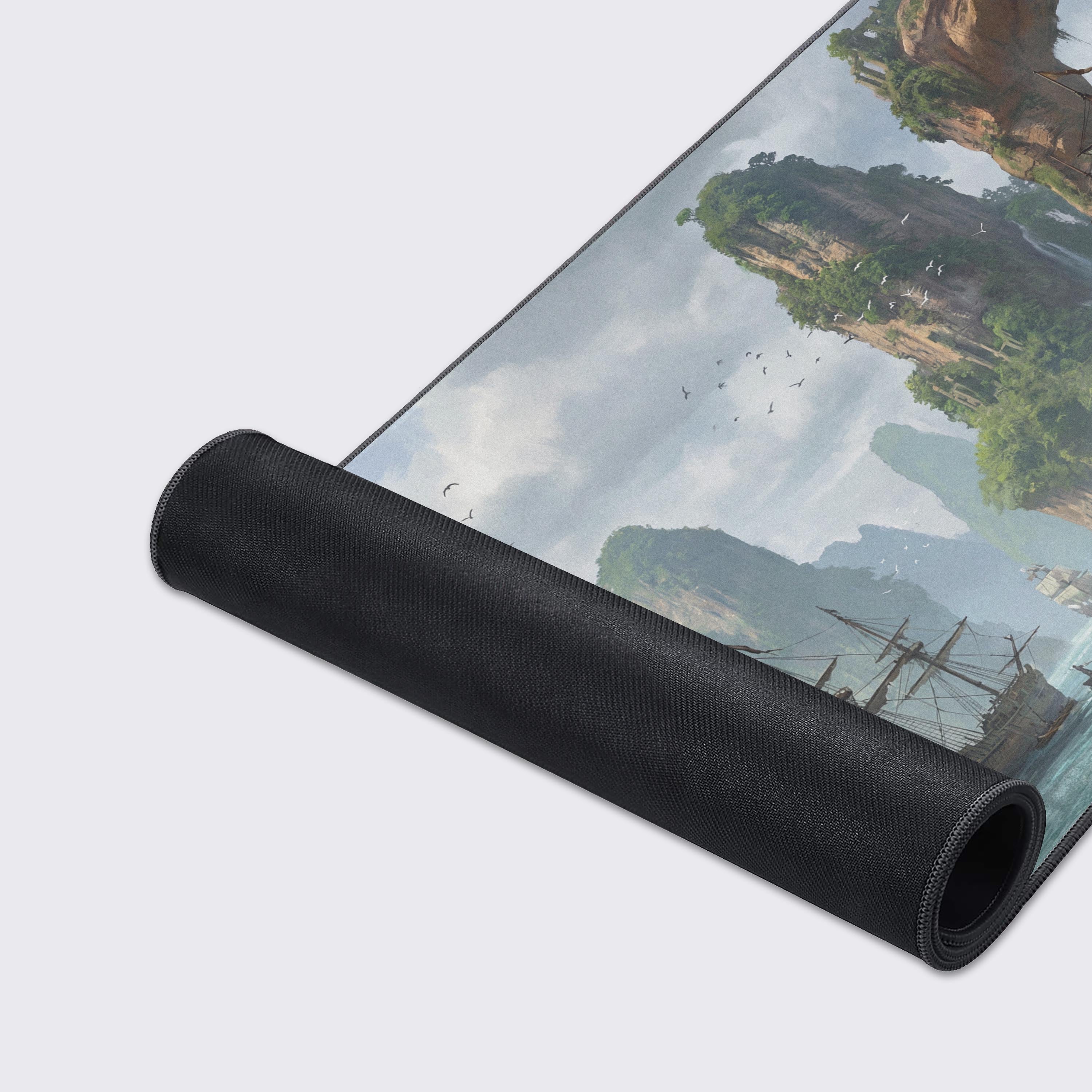 A close-up of the Verdant Voyage gaming desk mat highlighting the smooth fabric texture and durable stitched edges, with the detailed pirate ship art. - Epic Design Pads & Mousepads