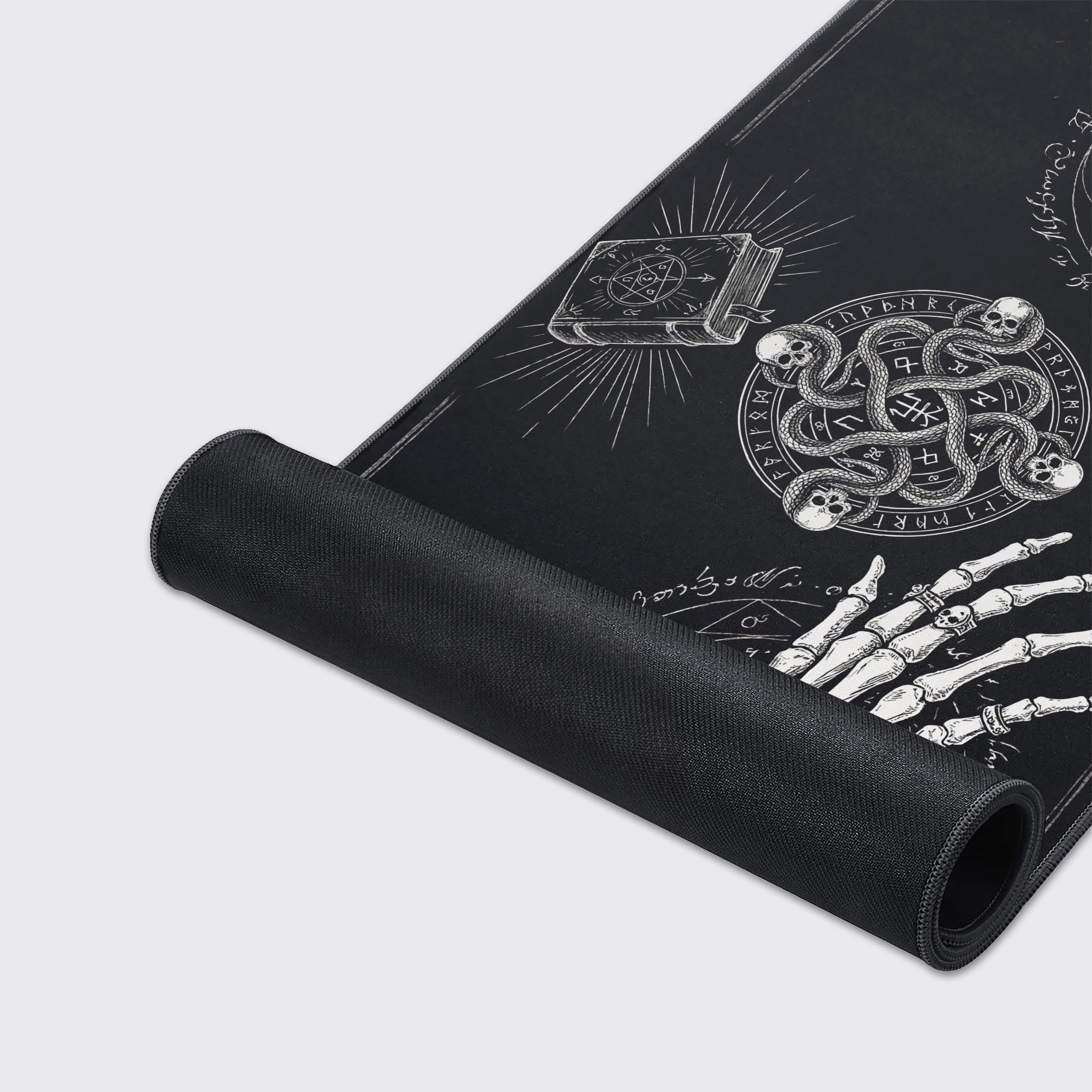 Close-up of the Grimoire Bind gaming desk mat, showcasing the smooth fabric texture, durable stitched edges, and detailed monochrome gothic artwork. - Epic Design Pads & Mousepads