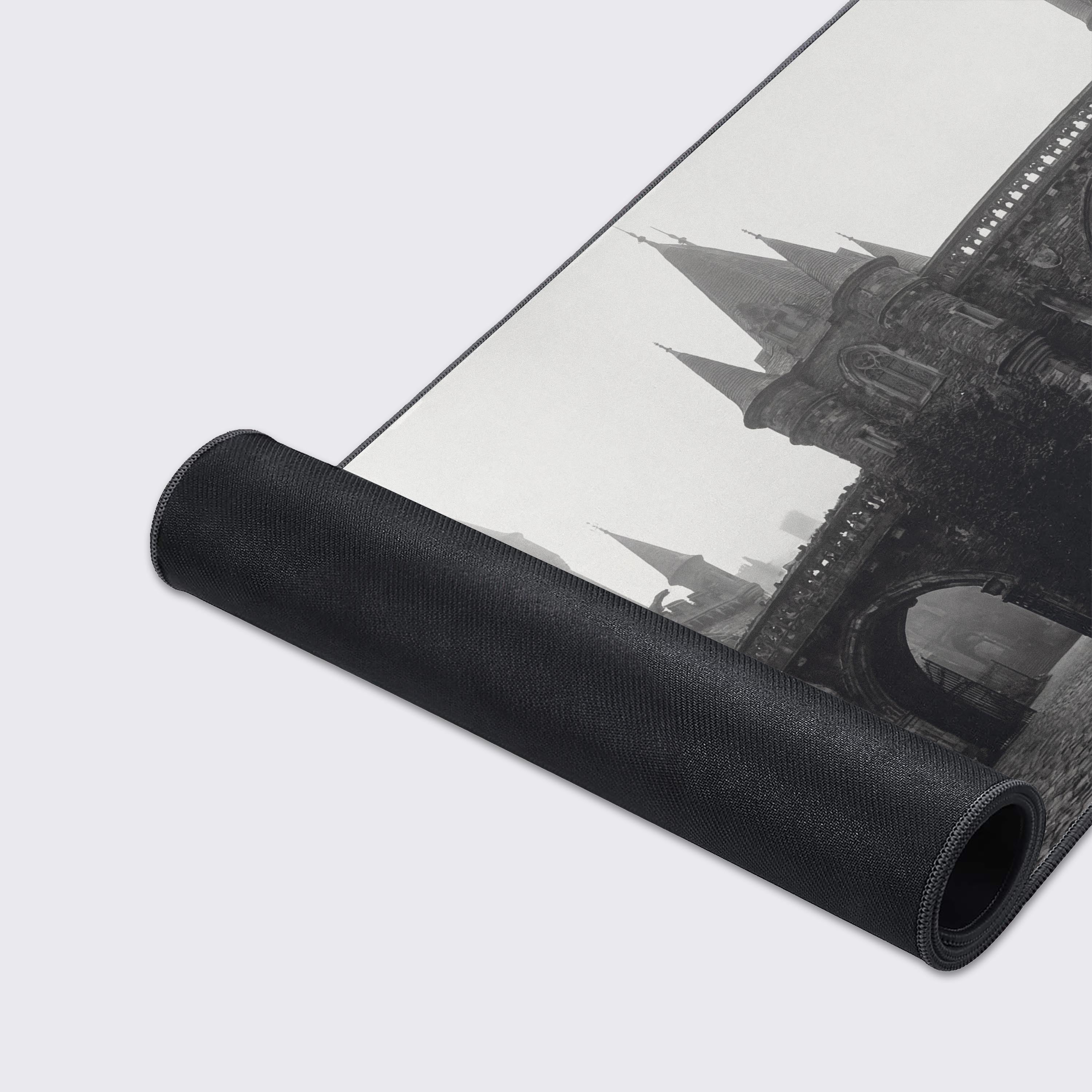 A close-up of the Gothic Courtyard mouse pad, highlighting the detailed print of the castle architecture and the durable, stitched edges of the smooth fabric surface. - Epic Design Pads & Mousepads