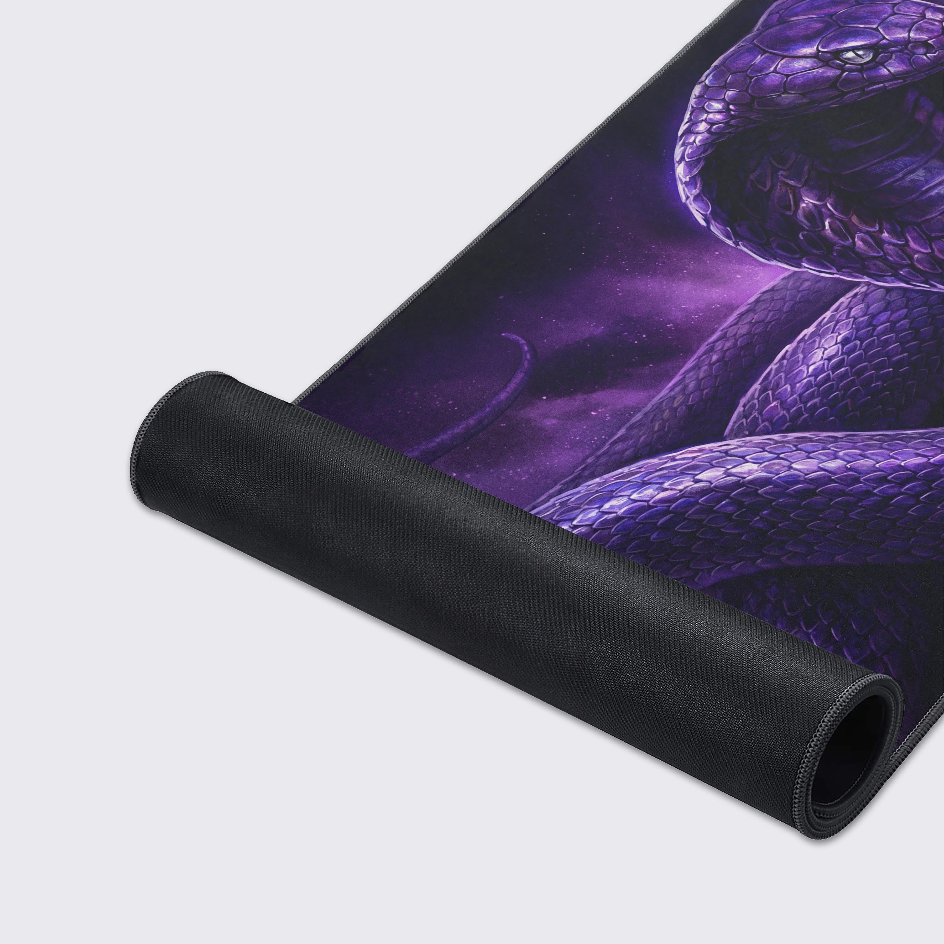 A close-up of the Nebula Cobra mouse pad, showcasing the detailed purple snake scales and durable stitched edges for a premium feel. - Epic Design Pads & Mousepads