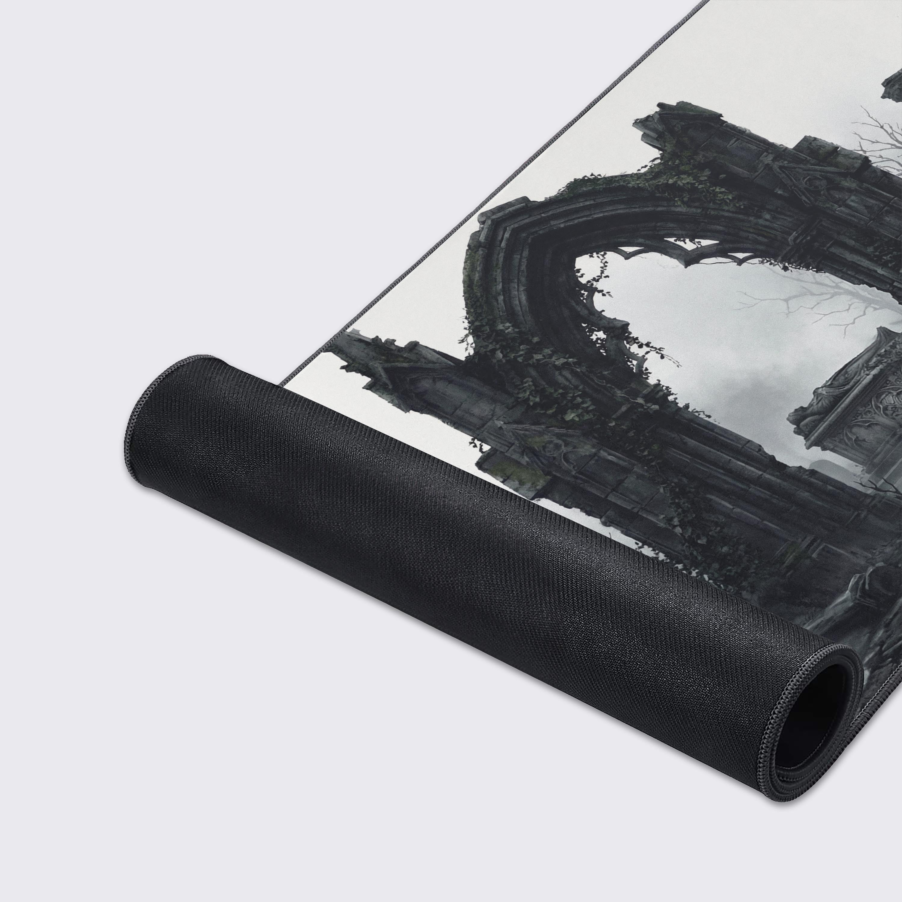 A close-up of the Stone Memory Mouse Pad showing the high-quality stitched edges and smooth fabric texture, detailing the crumbling stone arch of the graveyard design. - Epic Design Pads & Mousepads