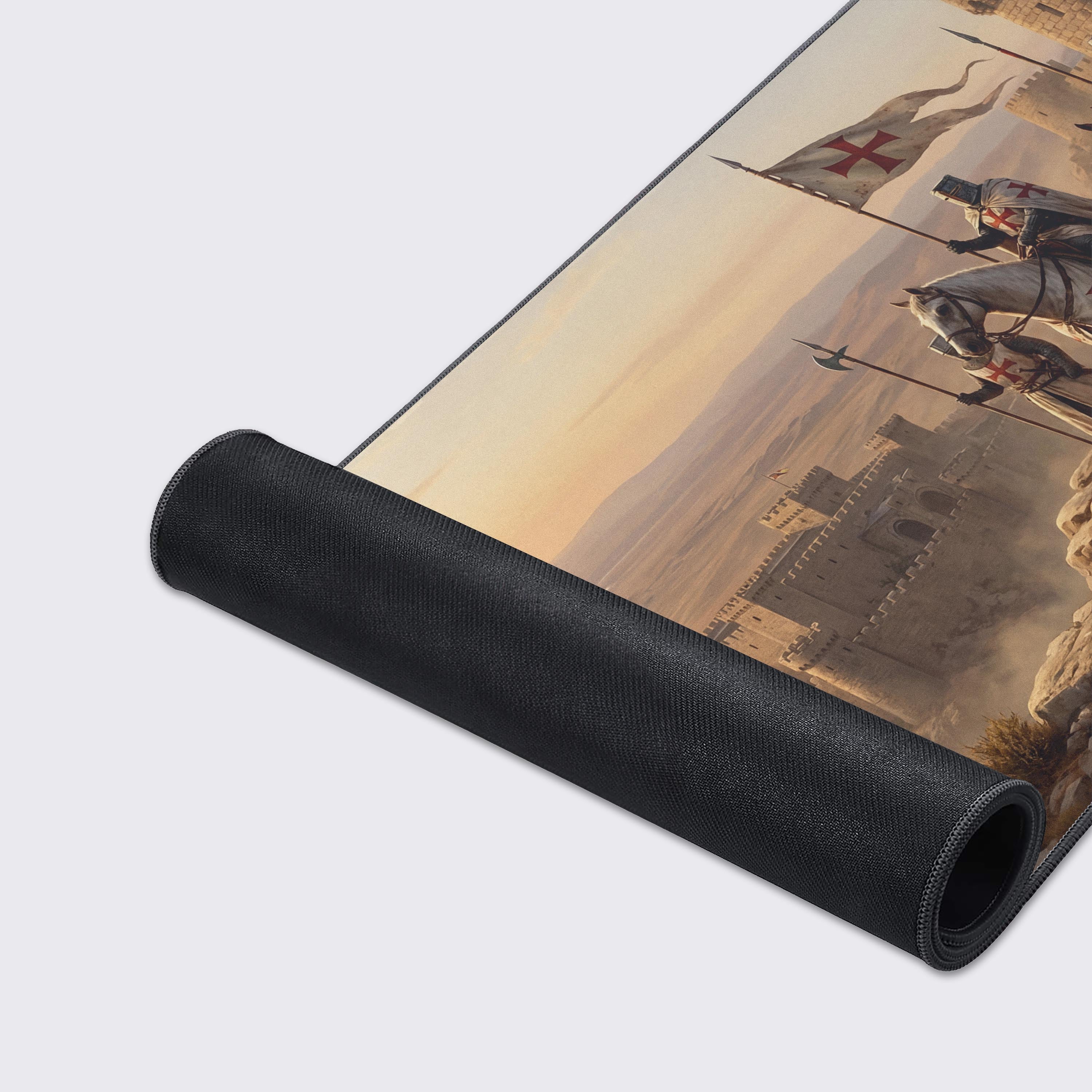 A close-up of the Fortress Command gaming desk mat highlighting the high-quality stitched edges and smooth fabric texture of the knight and castle artwork. - Epic Design Pads & Mousepads