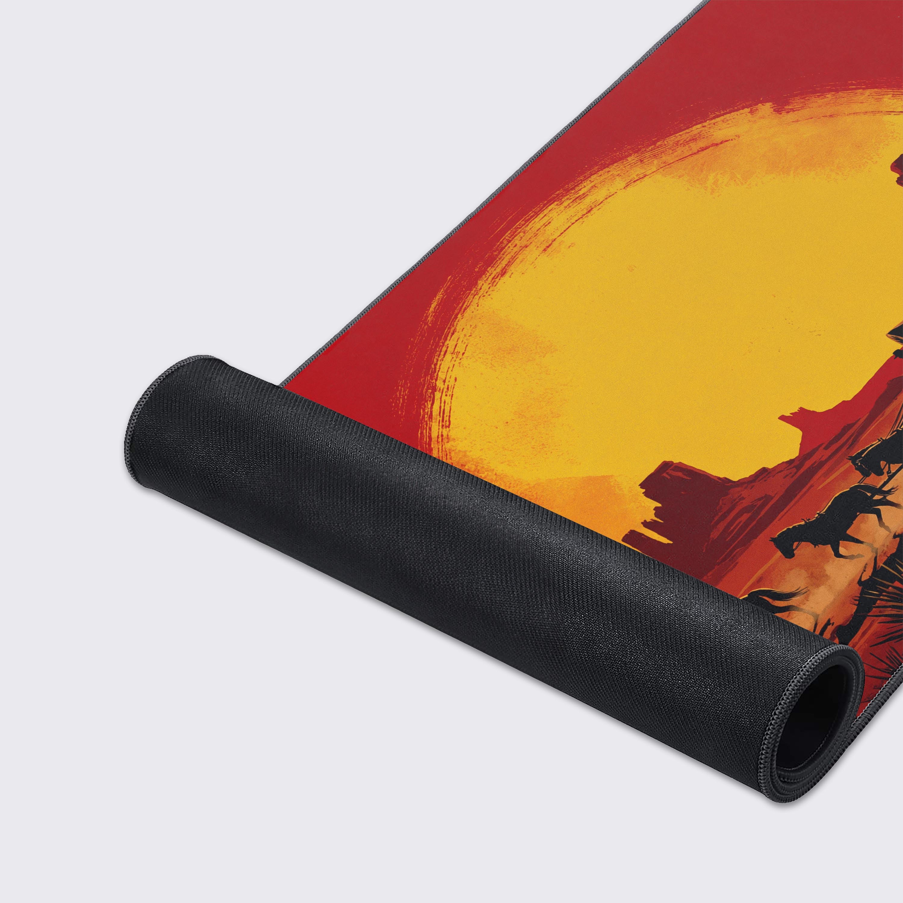 A close-up of the Outlaw's Path mouse pad showcases its high-quality fabric texture and durable stitched edges, with the western wagon train design visible. - Epic Design Pads & Mousepads
