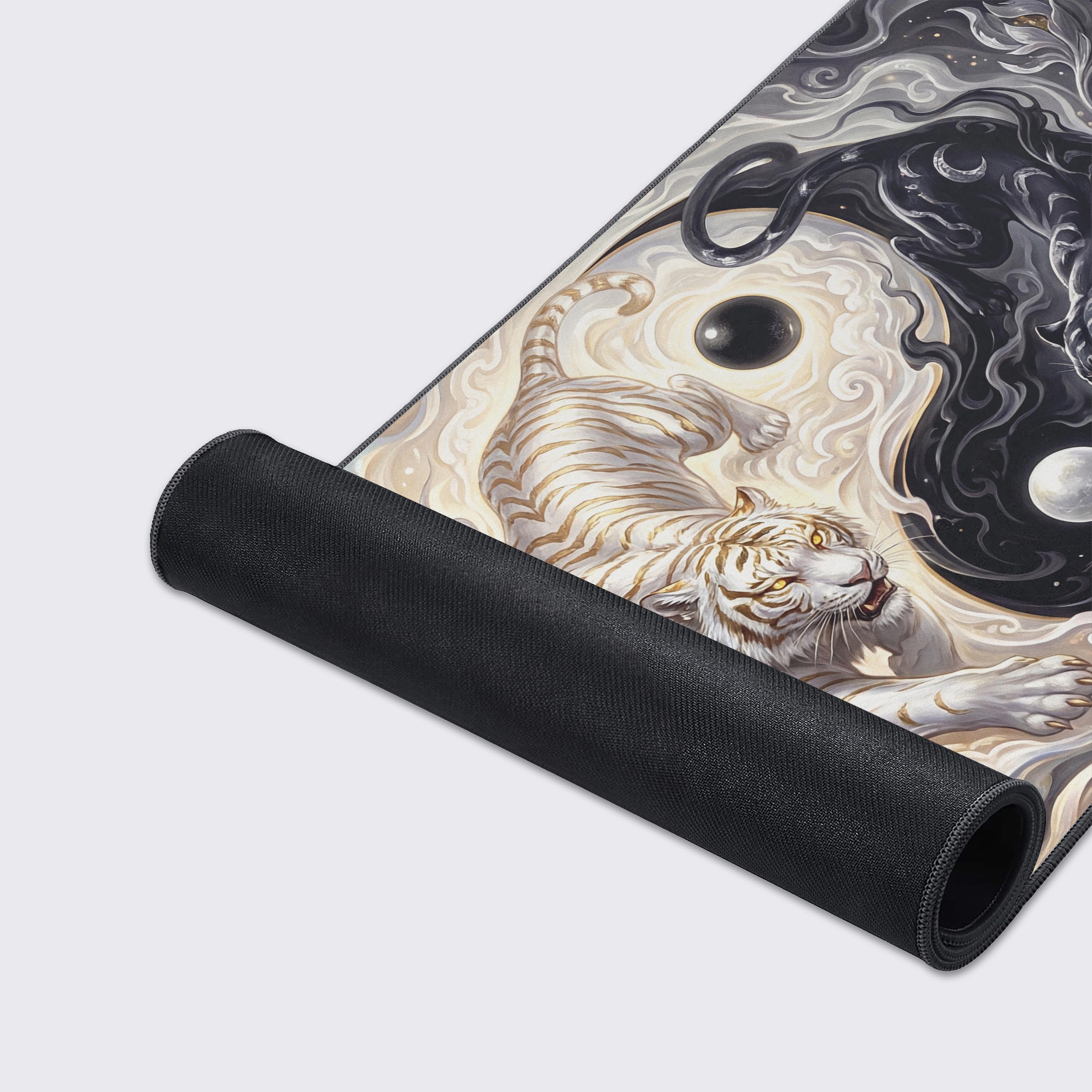 A close-up of the detailed artwork and premium stitched edges on the Primal Yin Yang Gaming Desk Mat, showcasing the smooth, high-quality fabric texture. - Epic Design Pads & Mousepads