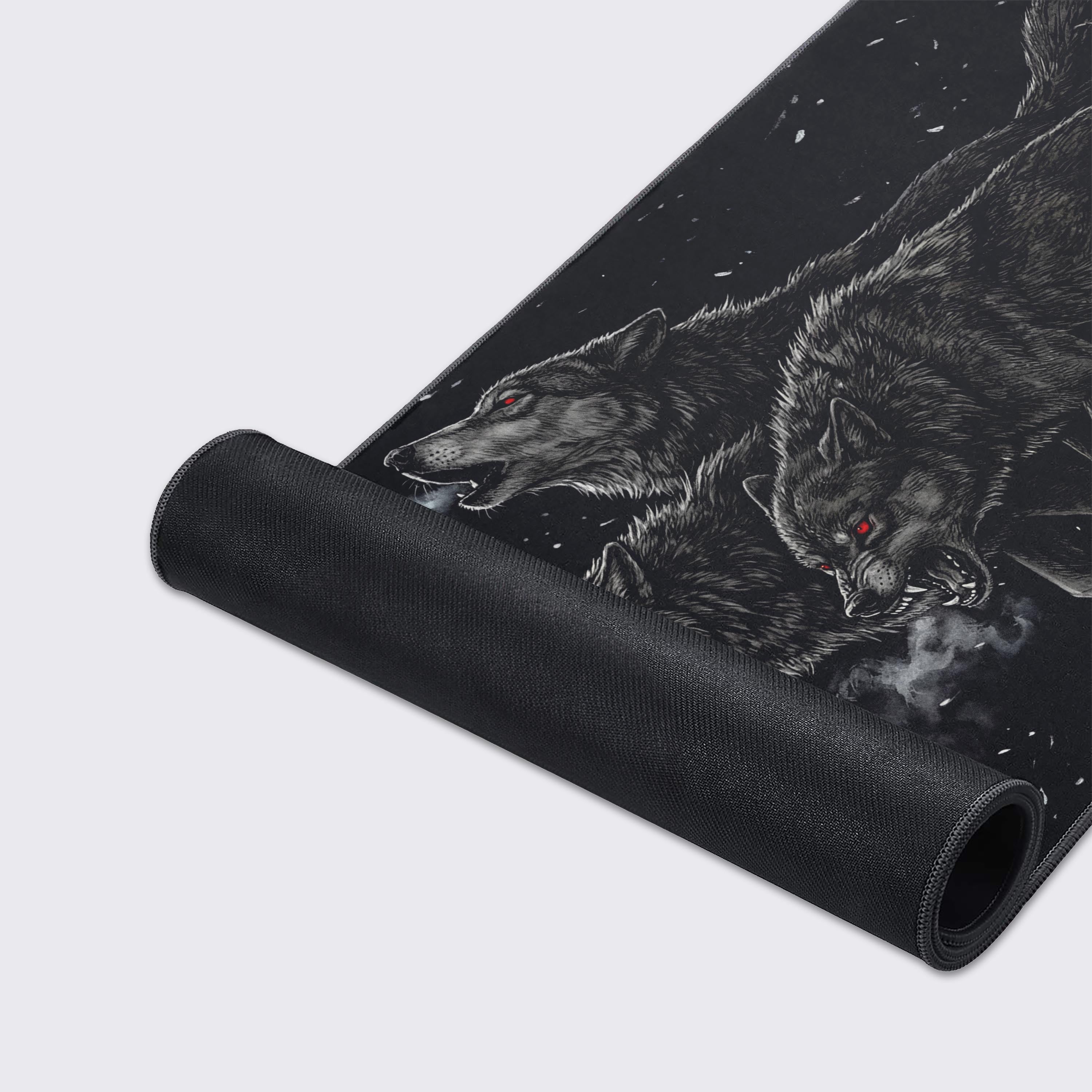 A close-up of the Relentless Pack mouse pad's high-quality fabric texture and durable stitched edges. The detailed artwork of a snarling wolf with red eyes is clearly visible. - Epic Design Pads & Mousepads