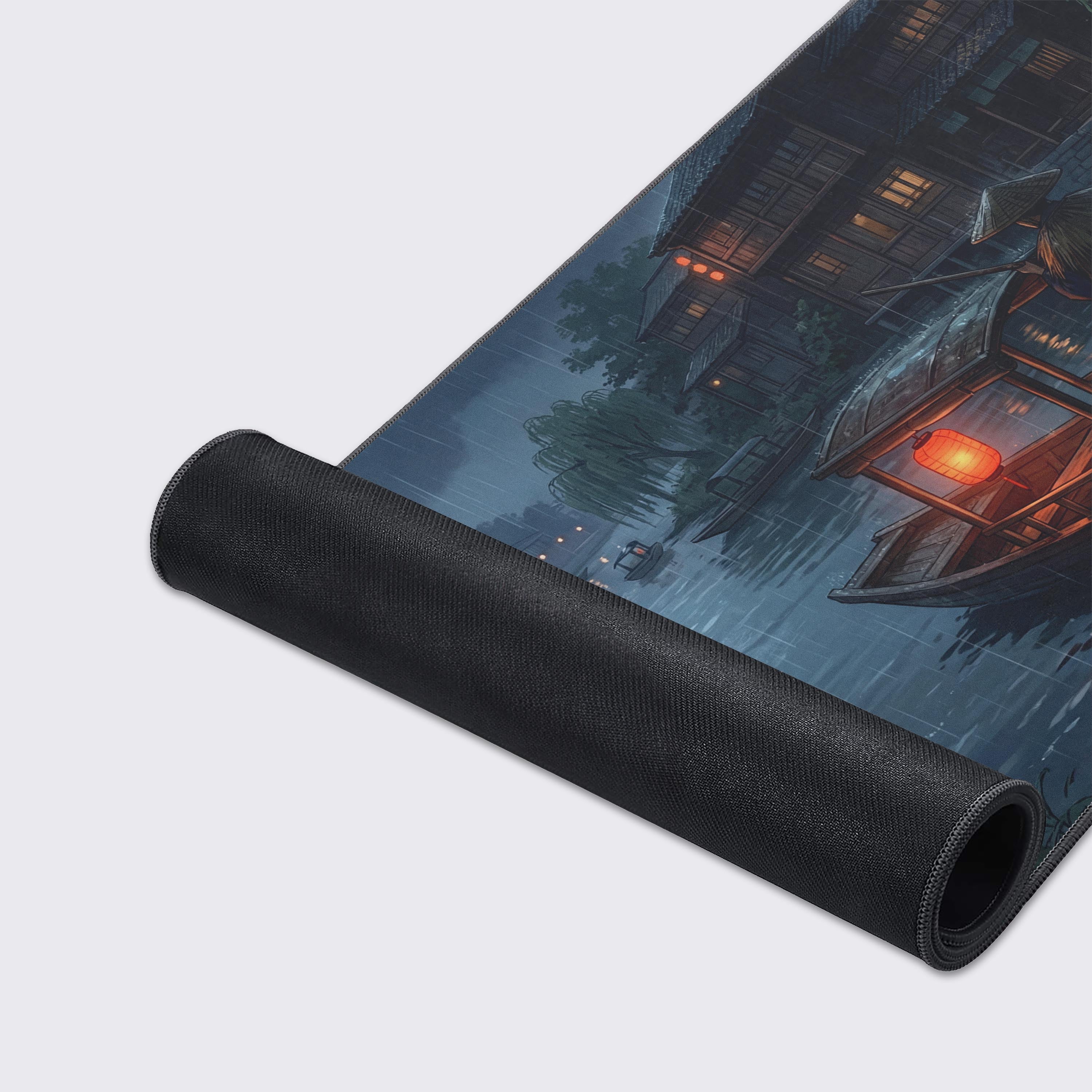 A close-up of the Silent Boatman gaming desk mat, showcasing the premium stitched edges, smooth fabric texture, and the detailed artwork of the boat. - Epic Design Pads & Mousepads