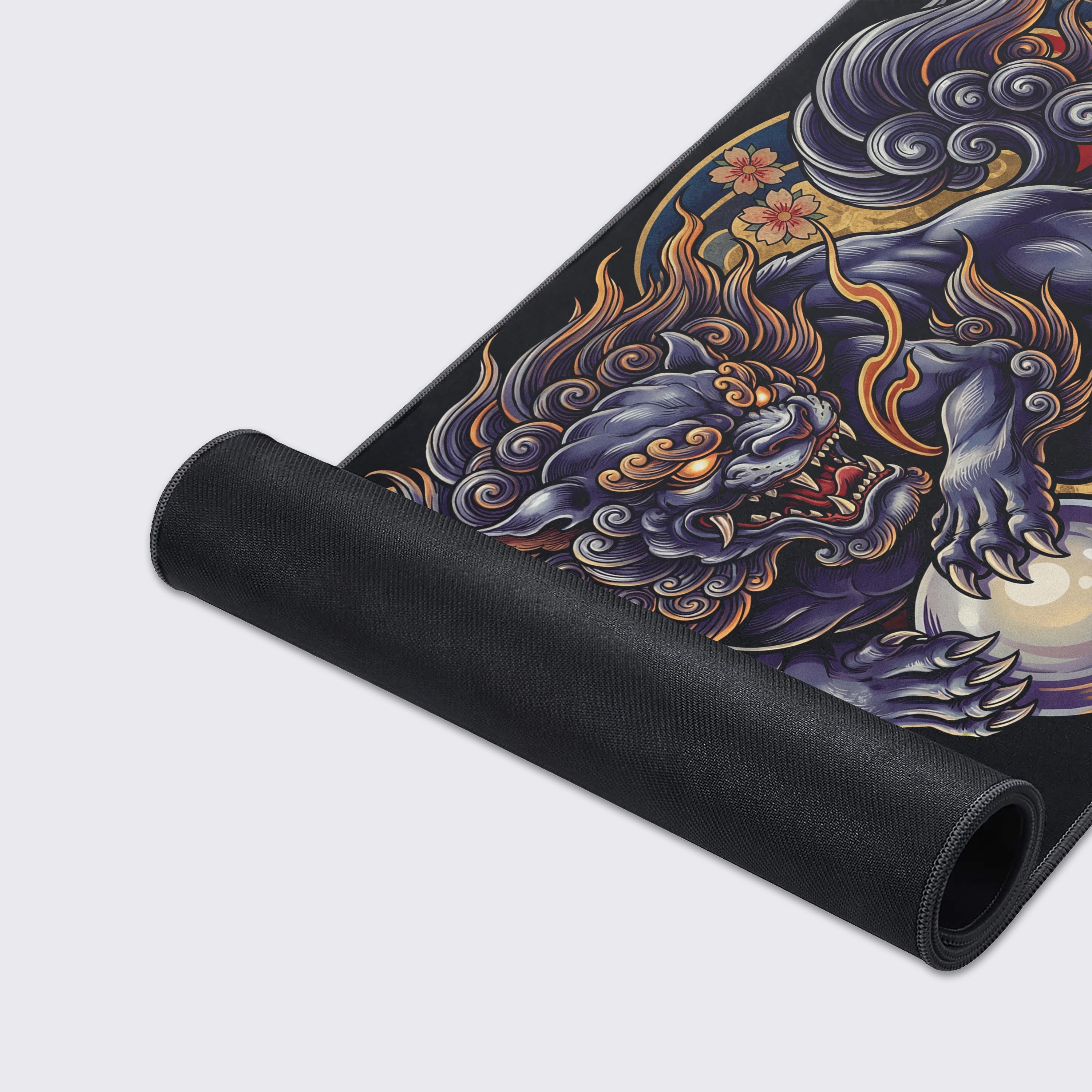 Close-up of the Komainu gaming desk mat, highlighting the smooth fabric texture, durable stitched edges, and intricate details of the guardian lion artwork. - Epic Design Pads & Mousepads