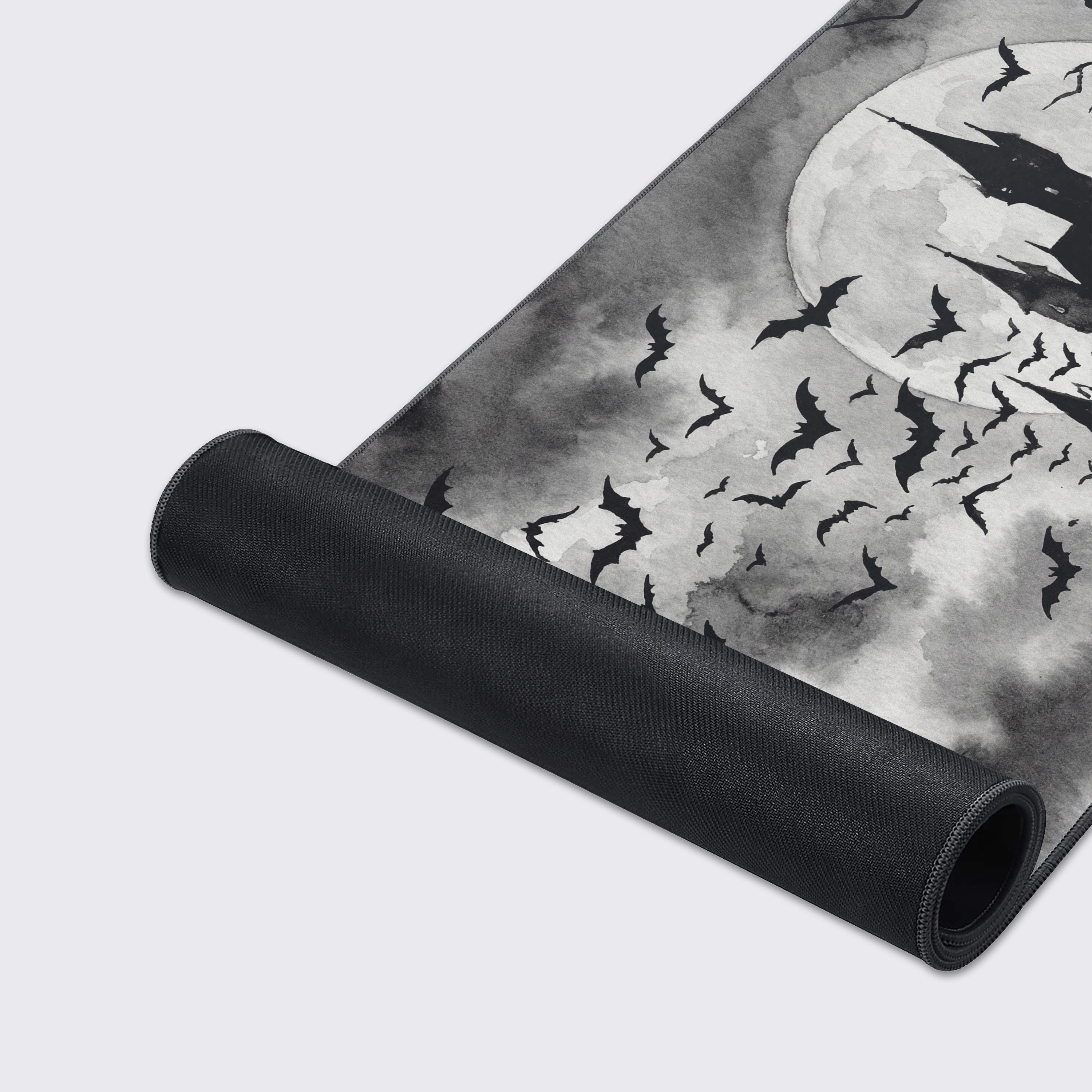 Close-up of the Shadowed Manor gaming desk mat's high-quality fabric texture and stitched edges, showcasing the detailed black and white gothic castle artwork. - Epic Design Pads & Mousepads
