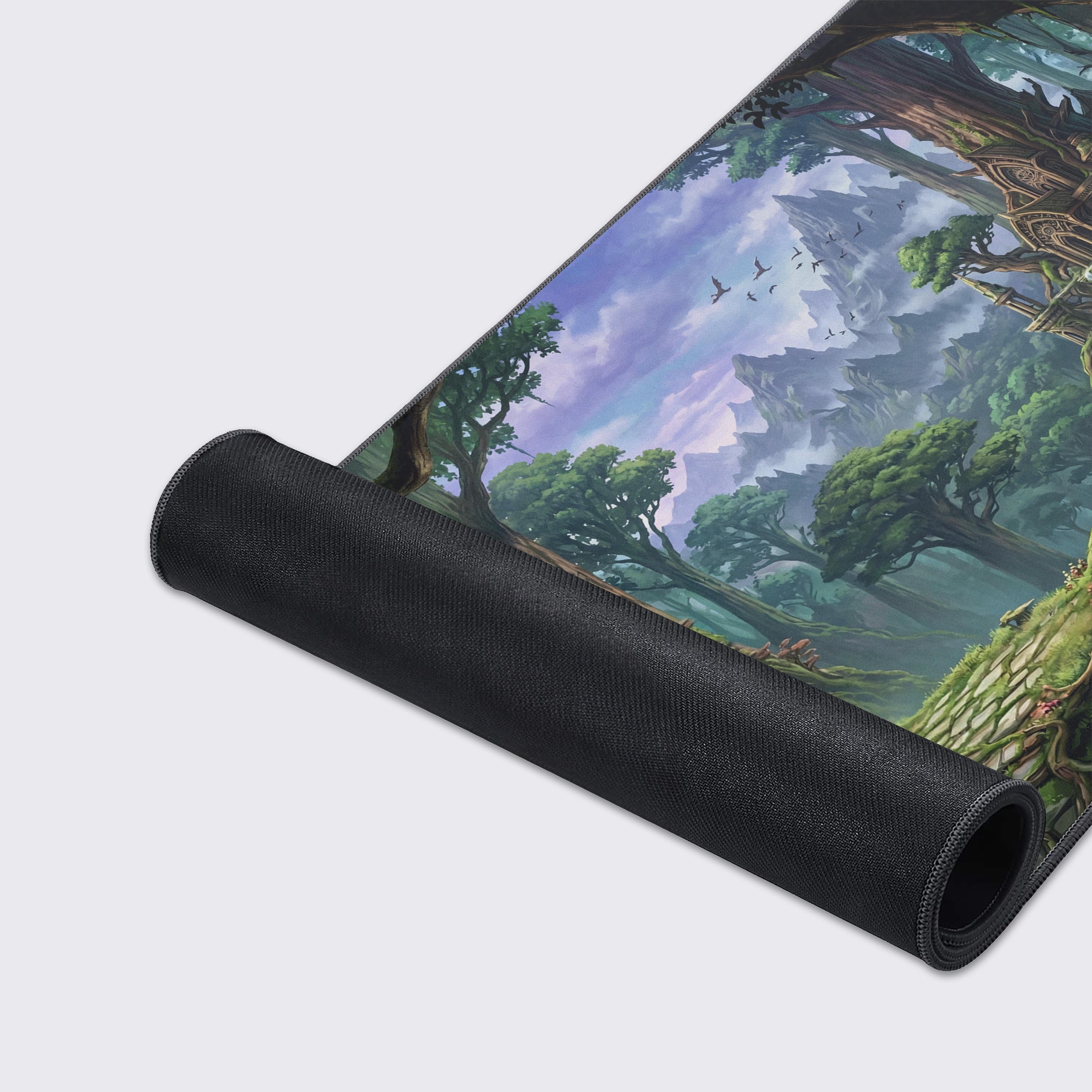 A close-up shot of the Mystic Woodlands gaming desk mat highlighting the high-quality fabric texture, durable stitched edges, and vibrant elven forest artwork. - Epic Design Pads & Mousepads