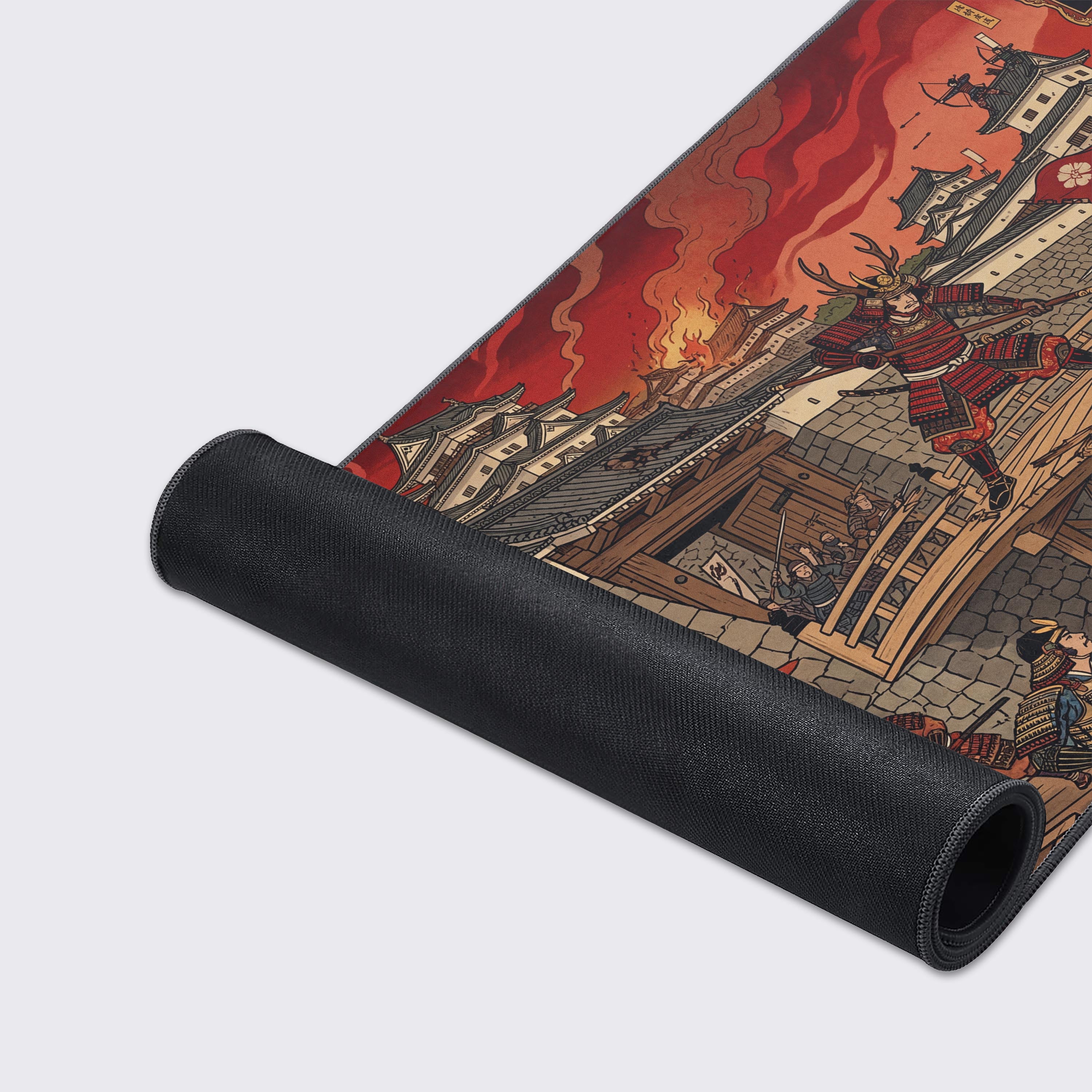 Close-up shot of the Kore-mon Breach gaming desk mat, highlighting the high-quality fabric texture and durable stitched edges of the Japanese samurai siege artwork. - Epic Design Pads & Mousepads