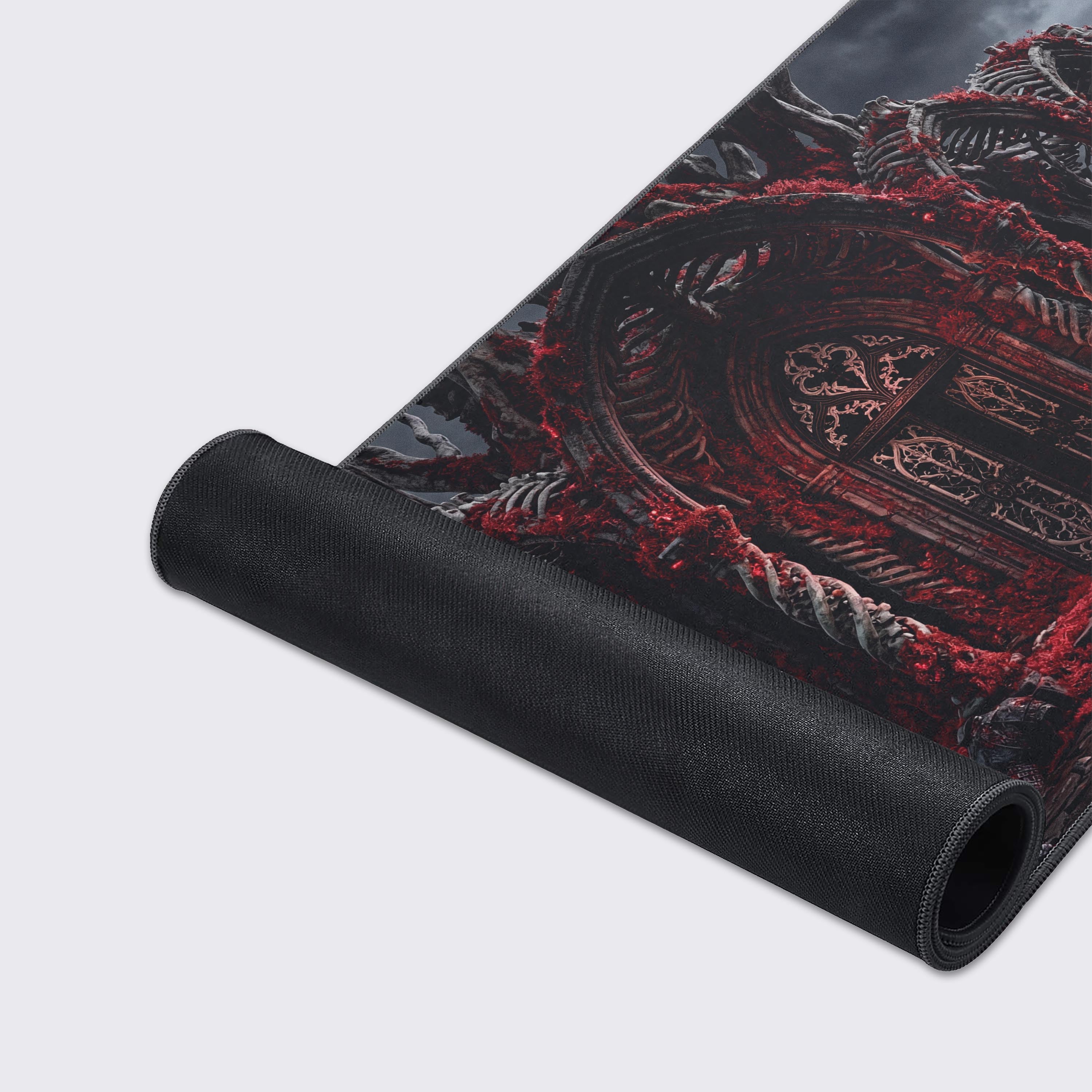 A close-up of the Forsaken Shrine gaming desk mat highlighting the high-quality stitched edges and smooth texture of the macabre skull artwork. - Epic Design Pads & Mousepads