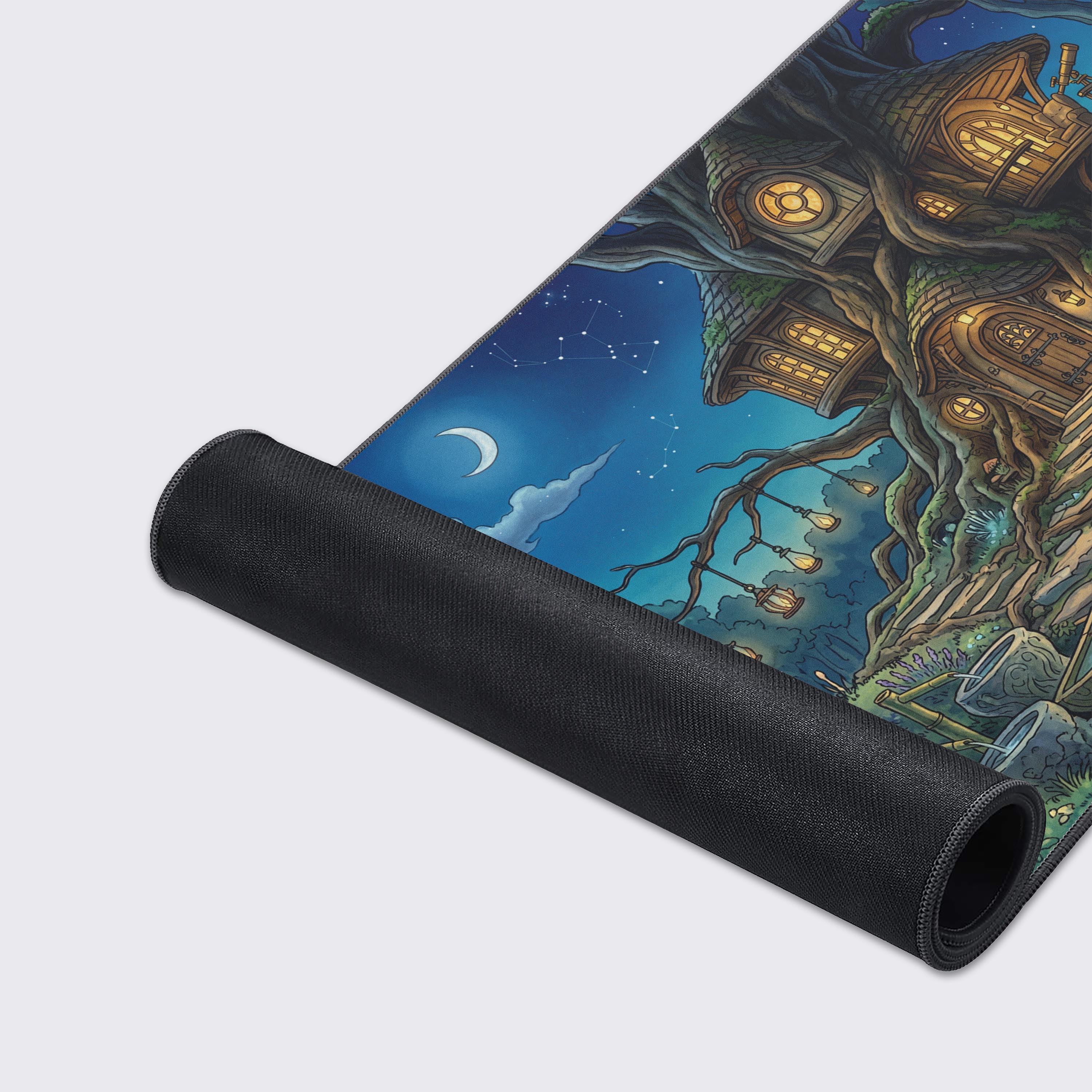 A close-up view of the Mystic Treehouse gaming desk mat showcasing the smooth fabric texture, durable stitched edges, and vibrant fantasy artwork. - Epic Design Pads & Mousepads