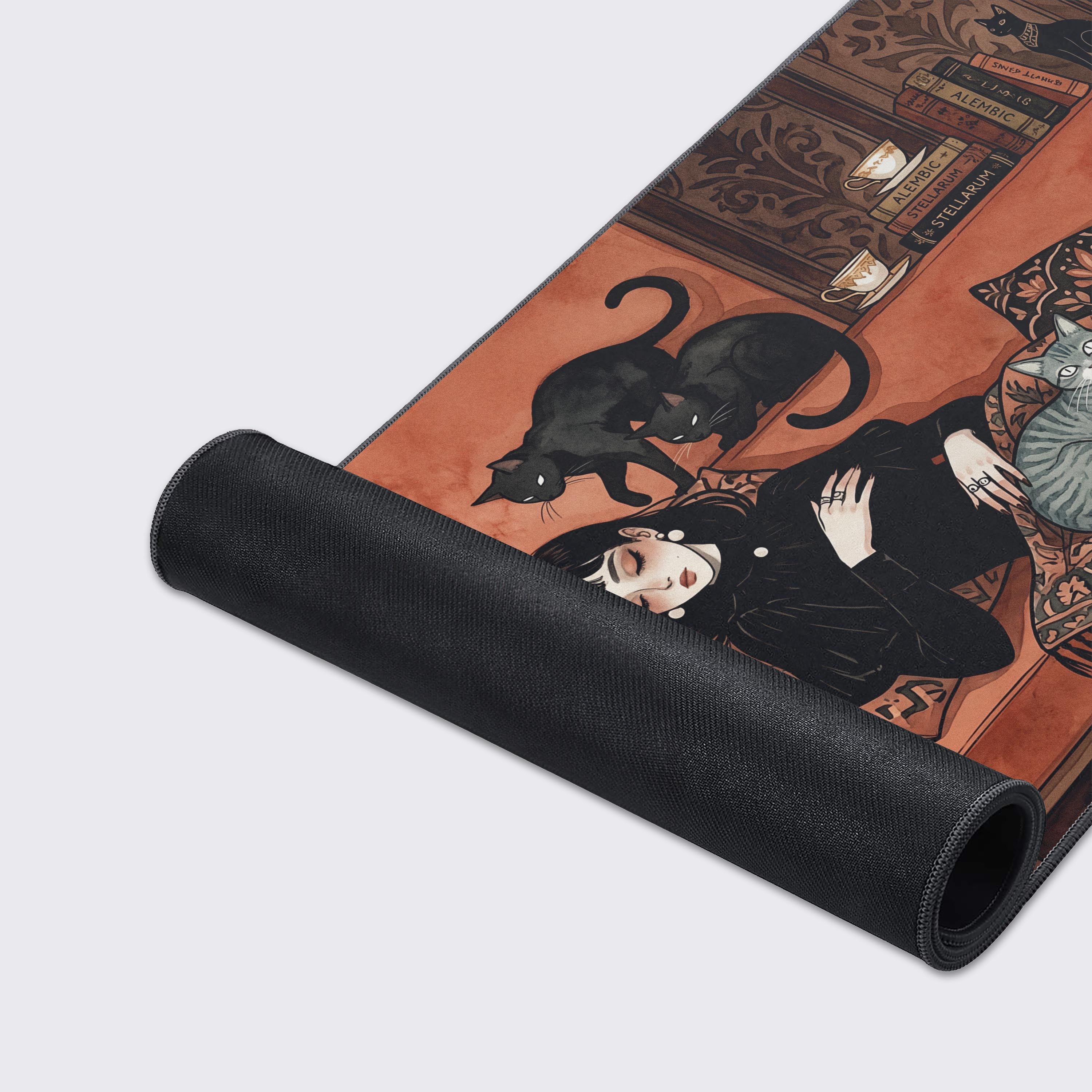 A close-up shot of the 'Familiar Rest' gaming desk mat, highlighting the detailed illustration, smooth fabric texture, and durable anti-fray stitched edges. - Epic Design Pads & Mousepads