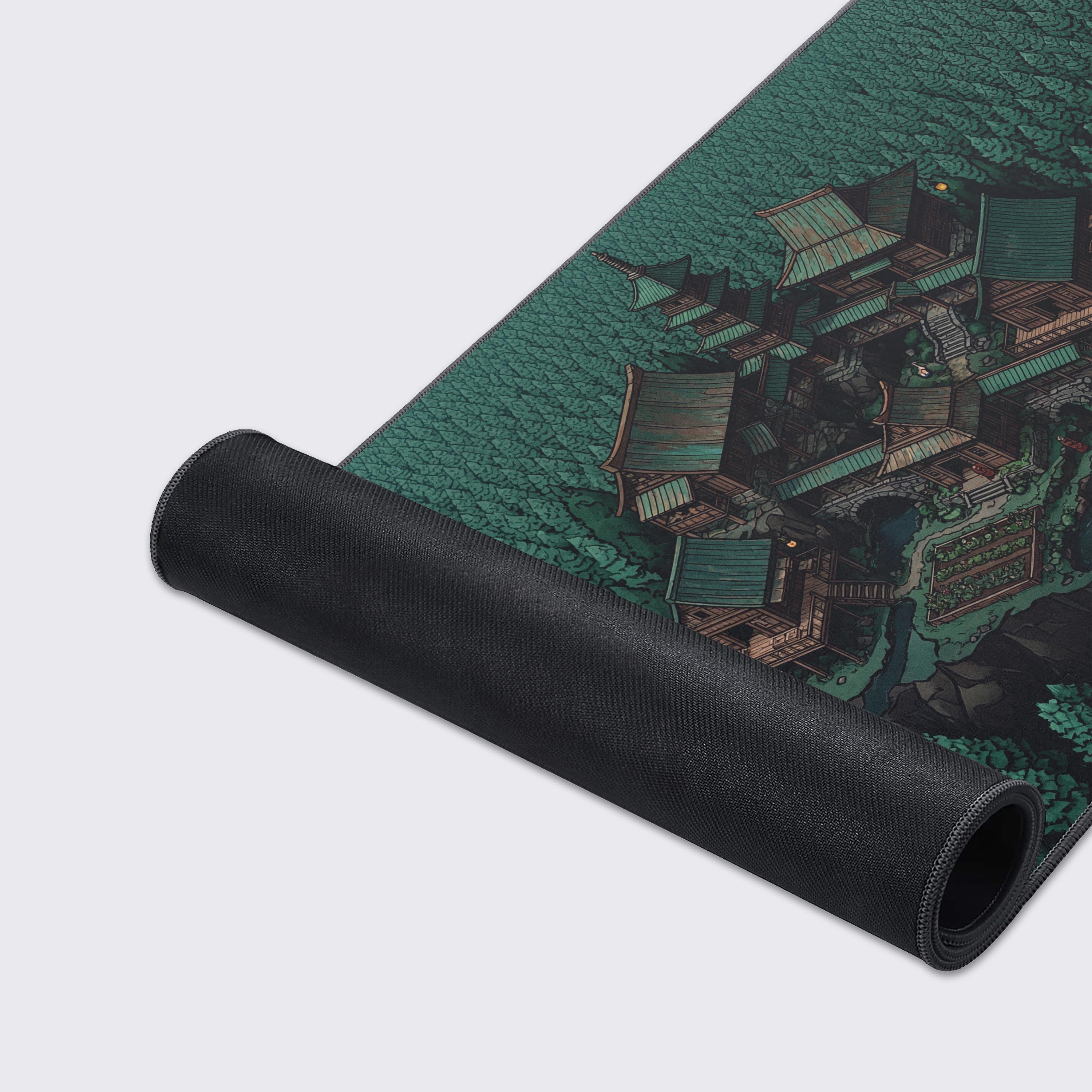 A close-up shot of the Hidden Enclave gaming desk mat, highlighting the detailed isometric forest art, premium fabric texture, and durable stitched edges for long-lasting use. - Epic Design Pads & Mousepads