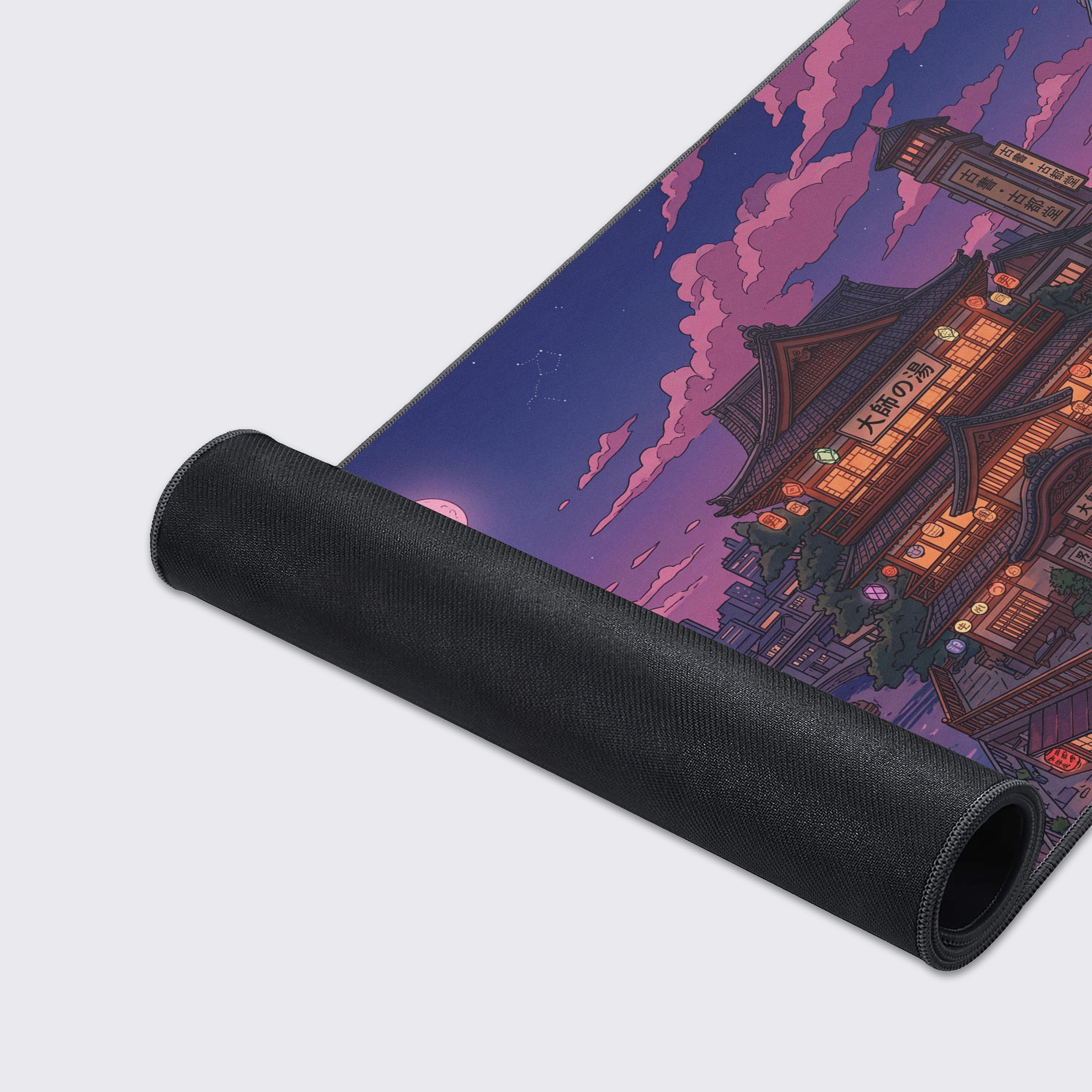 A close-up of the Spirit River Town mouse pad's high-quality texture and stitched edges, showcasing the detailed illustration of the Japanese bathhouse and canal. - Epic Design Pads & Mousepads