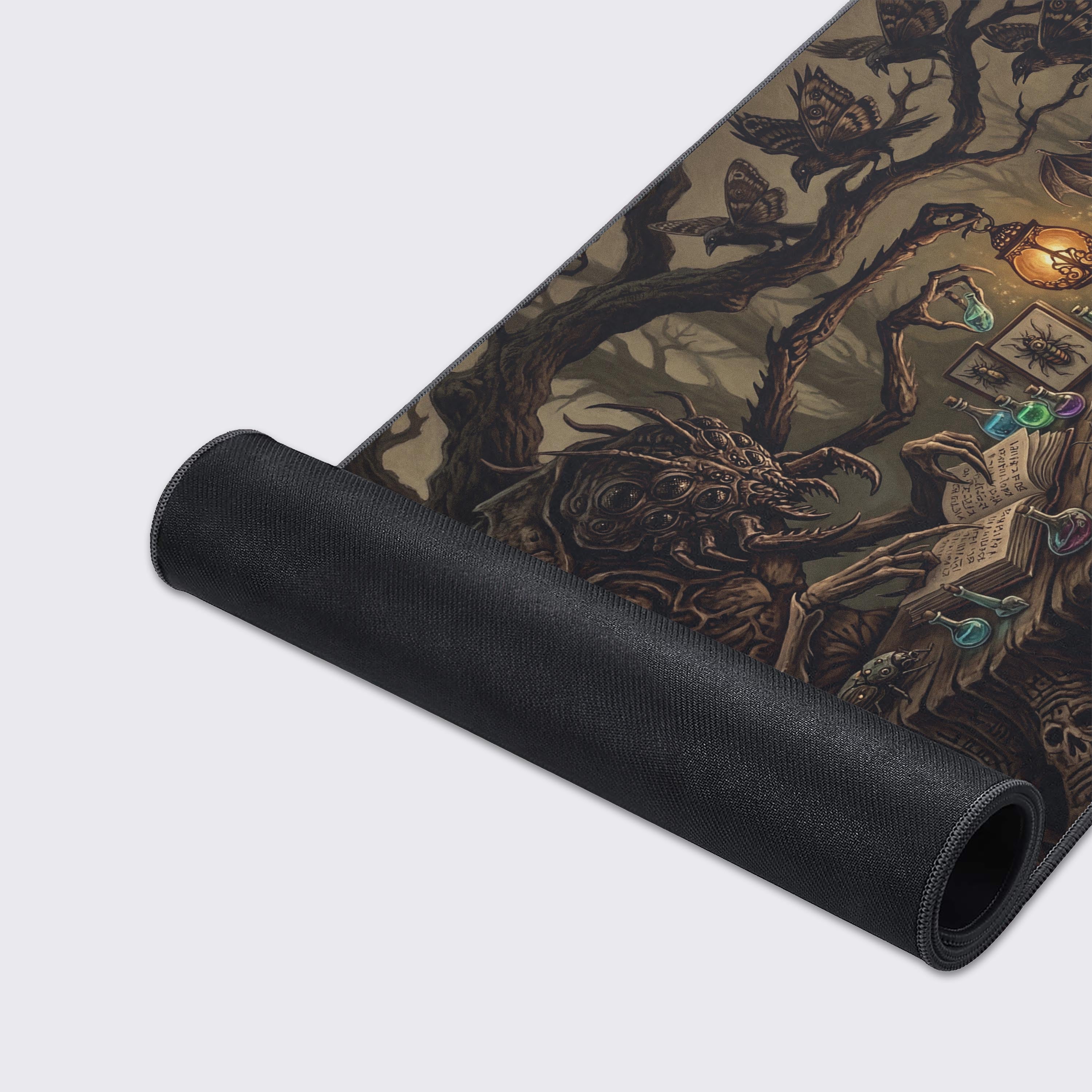 A close-up of the Arachnid Scholar gaming desk mat, highlighting the detailed monster artwork, smooth fabric texture, and durable stitched edges. - Epic Design Pads & Mousepads