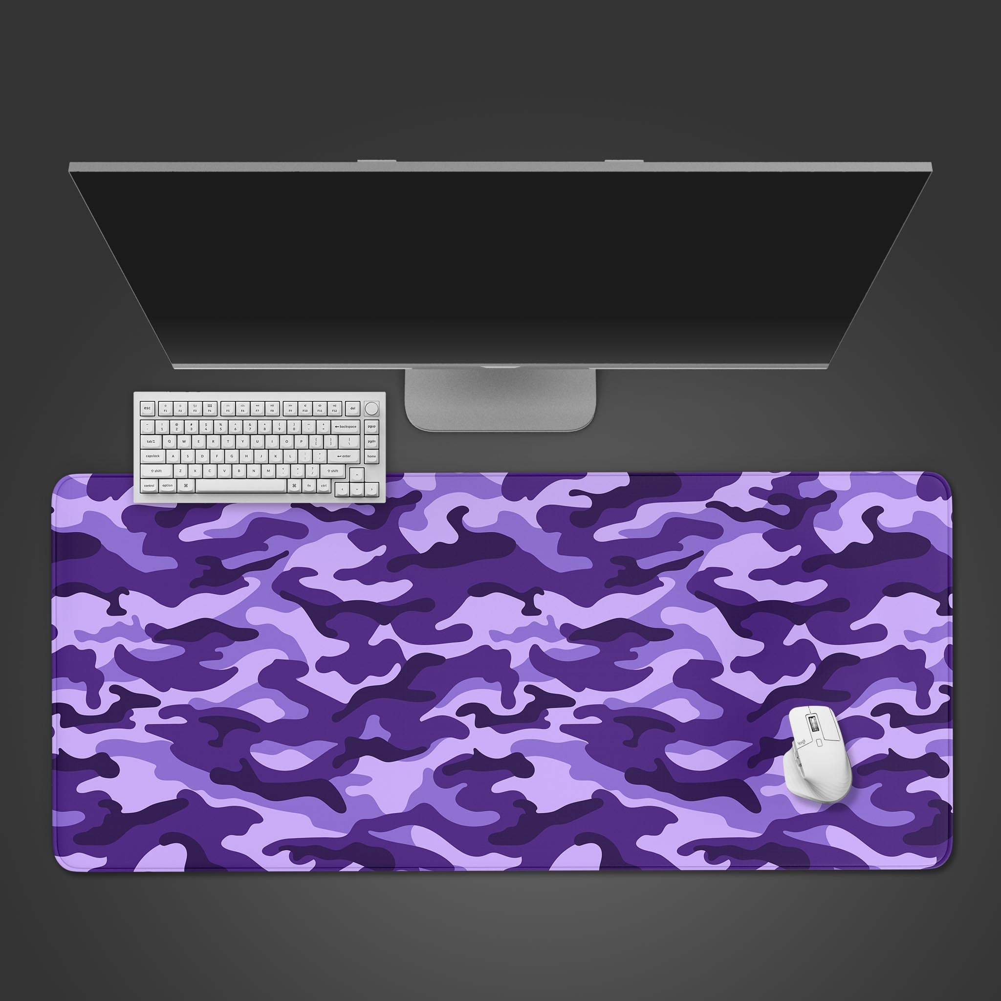 Amethyst Camo desk mat in a vibrant purple tactical pattern, shown from a top-down view with a gaming keyboard and mouse. - Epic Design Pads