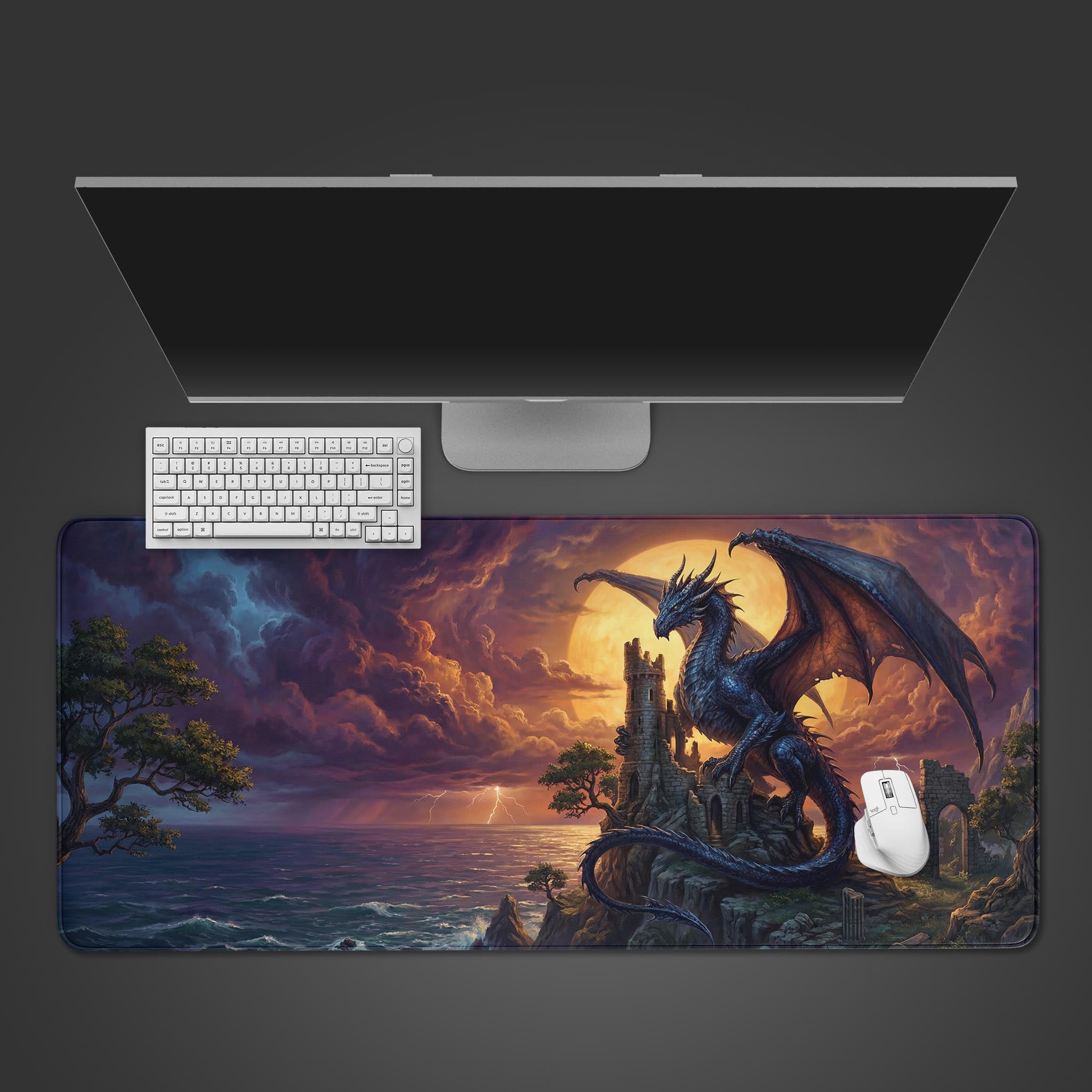 The 'Ancient Overlord' gaming desk mat featuring a majestic dragon on a castle, shown from above with a white keyboard and mouse. - Epic Design Pads & Mousepads