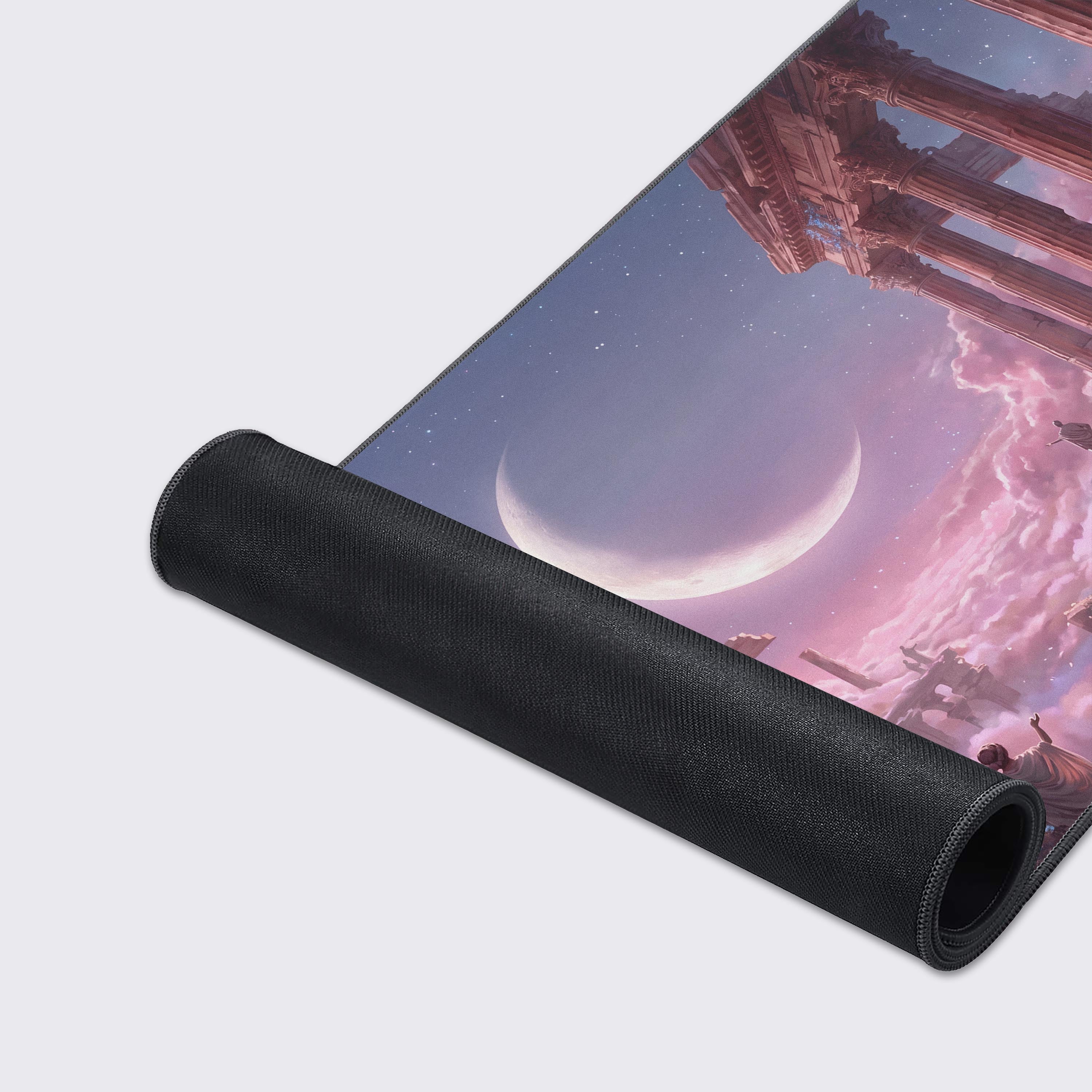 Mythological fantasy XL desk pad with a starry night sky, crescent moon, and dreamy pink nebula clouds.