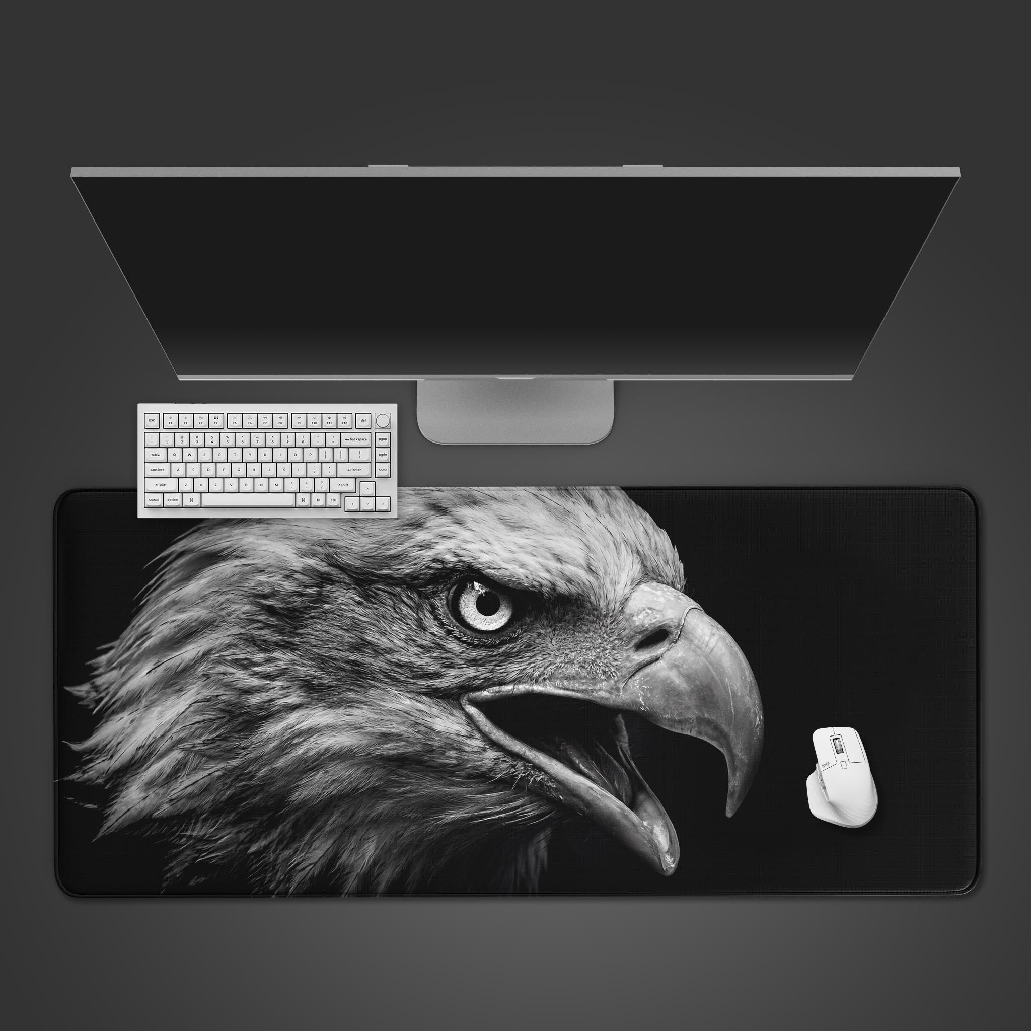 Top-down view of the Apex Vision eagle Gaming Desk Mat with a white keyboard and mouse, showcasing the intense monochrome design on a dark surface. - Epic Design Pads & Mousepads