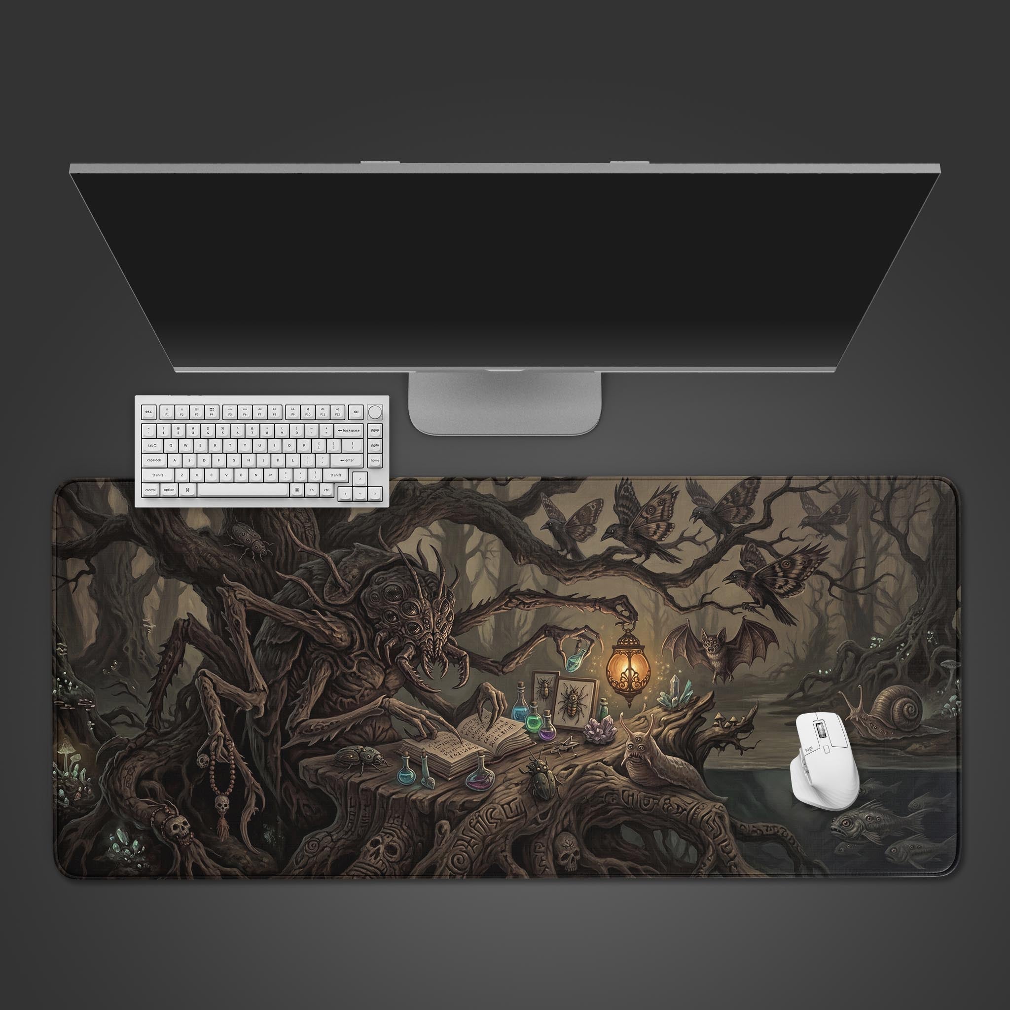 The Arachnid Scholar gaming desk mat on a dark surface with a white keyboard, mouse, and monitor, showcasing the full dark fantasy artwork. - Epic Design Pads & Mousepads