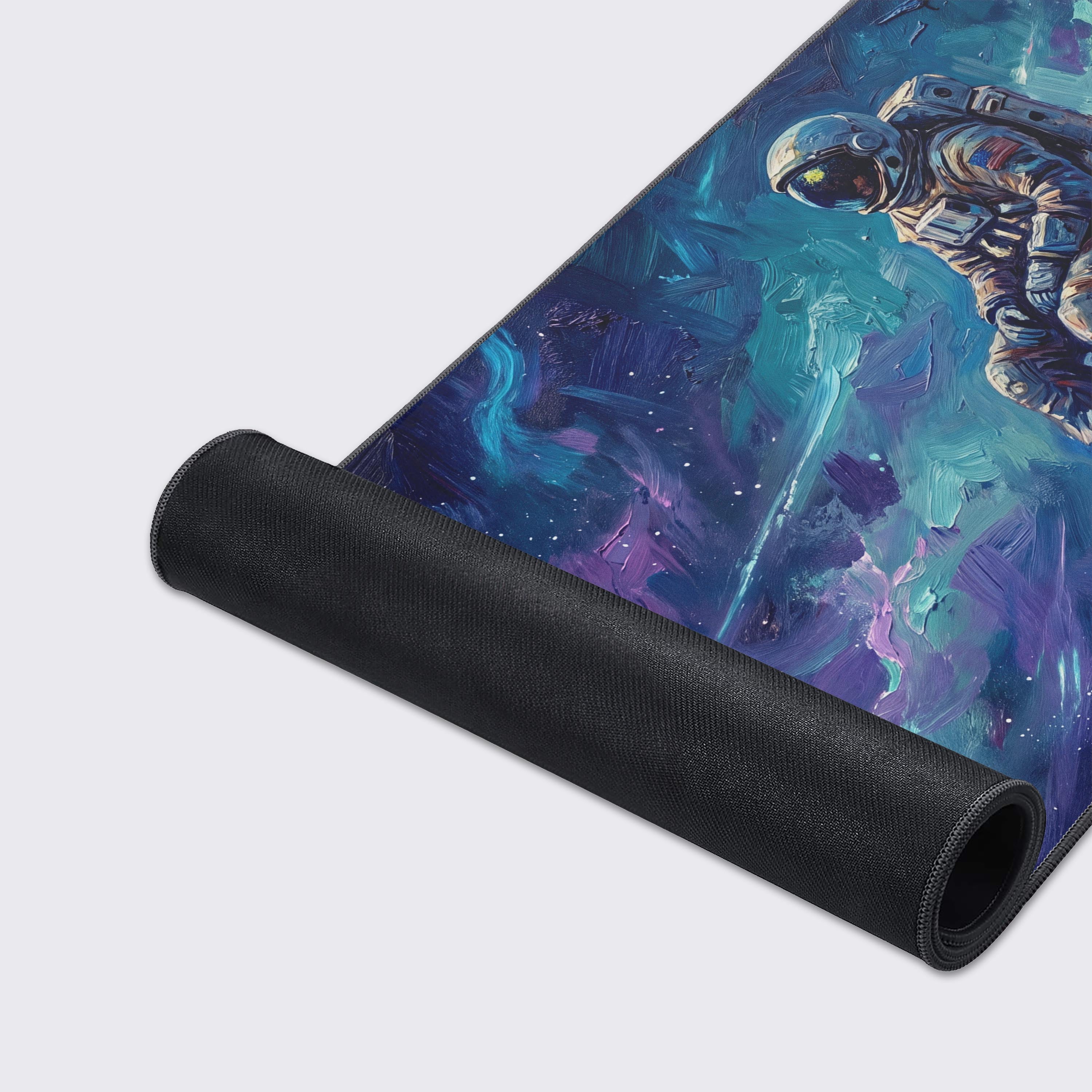 The space-themed desk mat hovering above a reflective surface, showcasing its vibrant cyan and magenta colors.