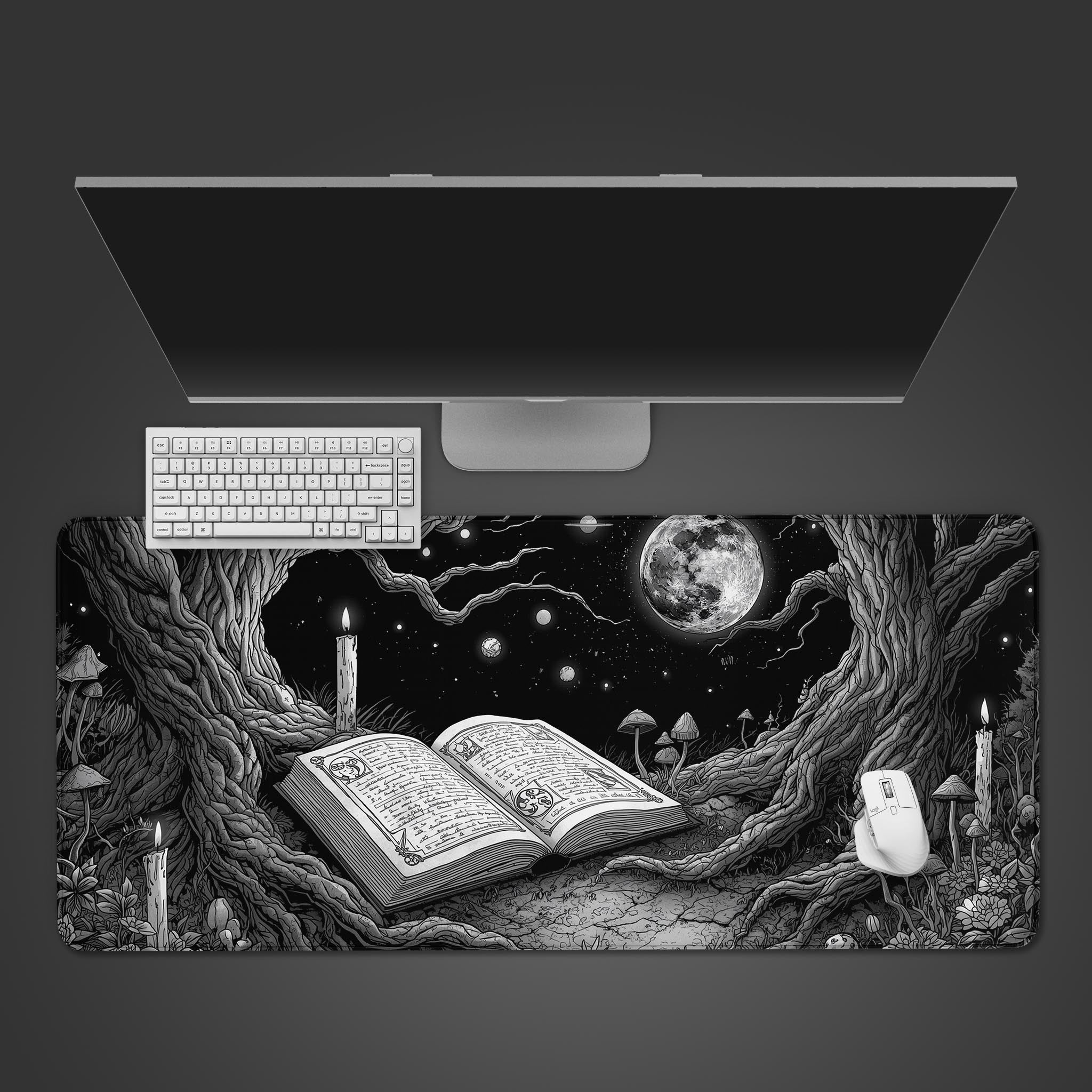 Black Alchemy Cottagecore desk mat with a starry book design, shown from a top-down view with a keyboard and mouse. - Epic Design Pads