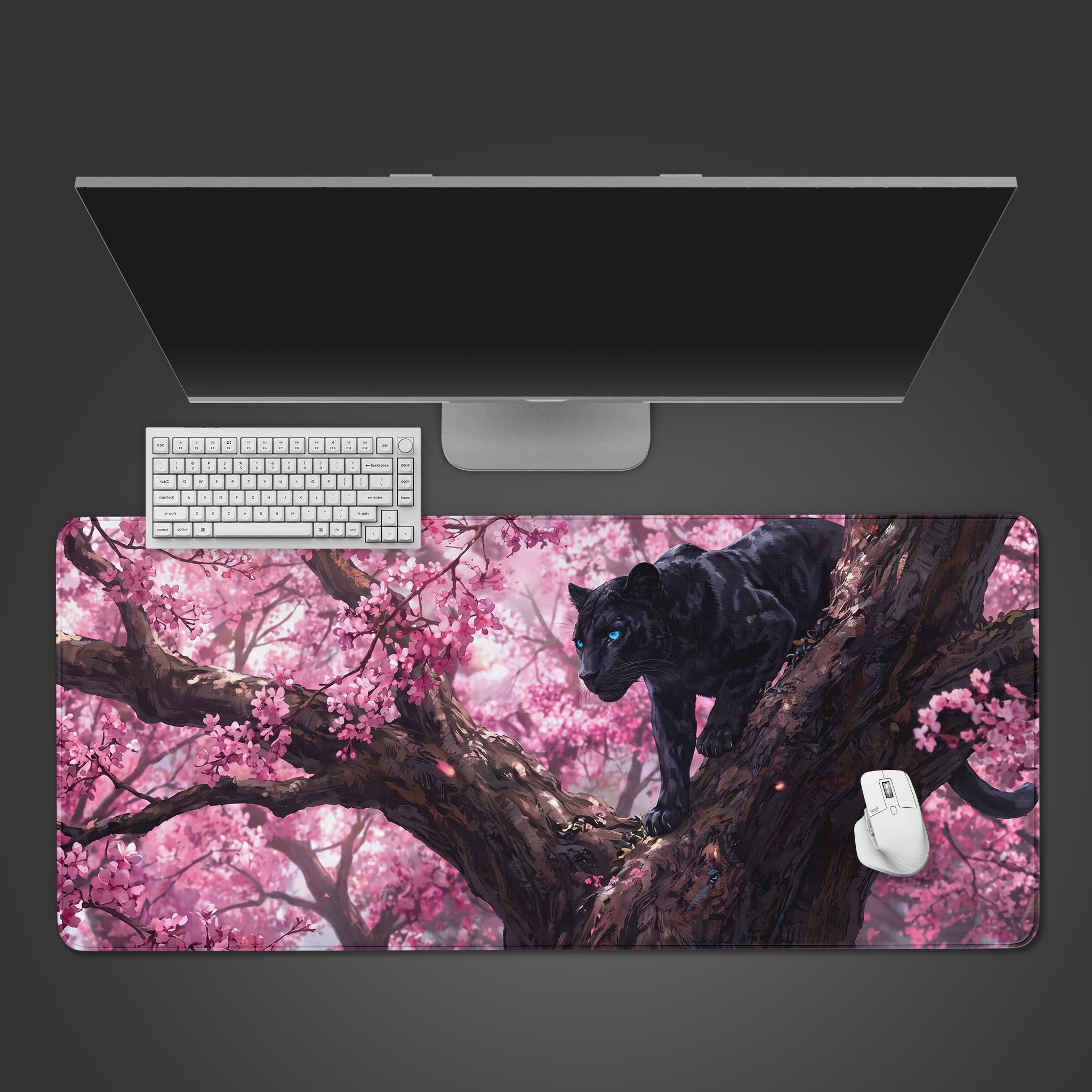 A large desk mat featuring a black panther with blue eyes climbing a tree branch among pink cherry blossoms