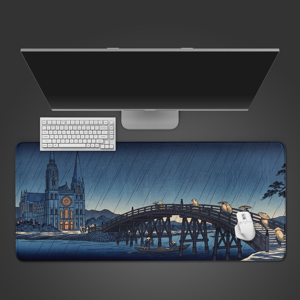 Blue cathedral japanese desk mat seen from above with a white keyboard and mouse on rainy cathedral and bridge art