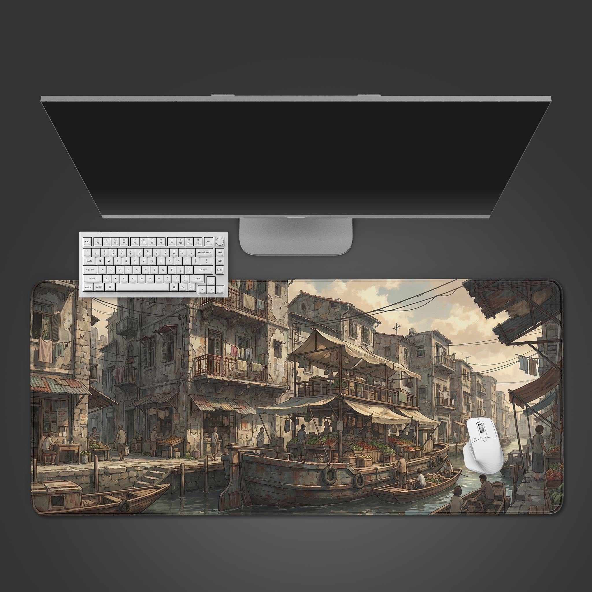 The 'Canal Commerce' gaming desk mat shown from a top-down view with a white keyboard and mouse, displaying its detailed historical river market artwork. - Epic Design Pads & Mousepads